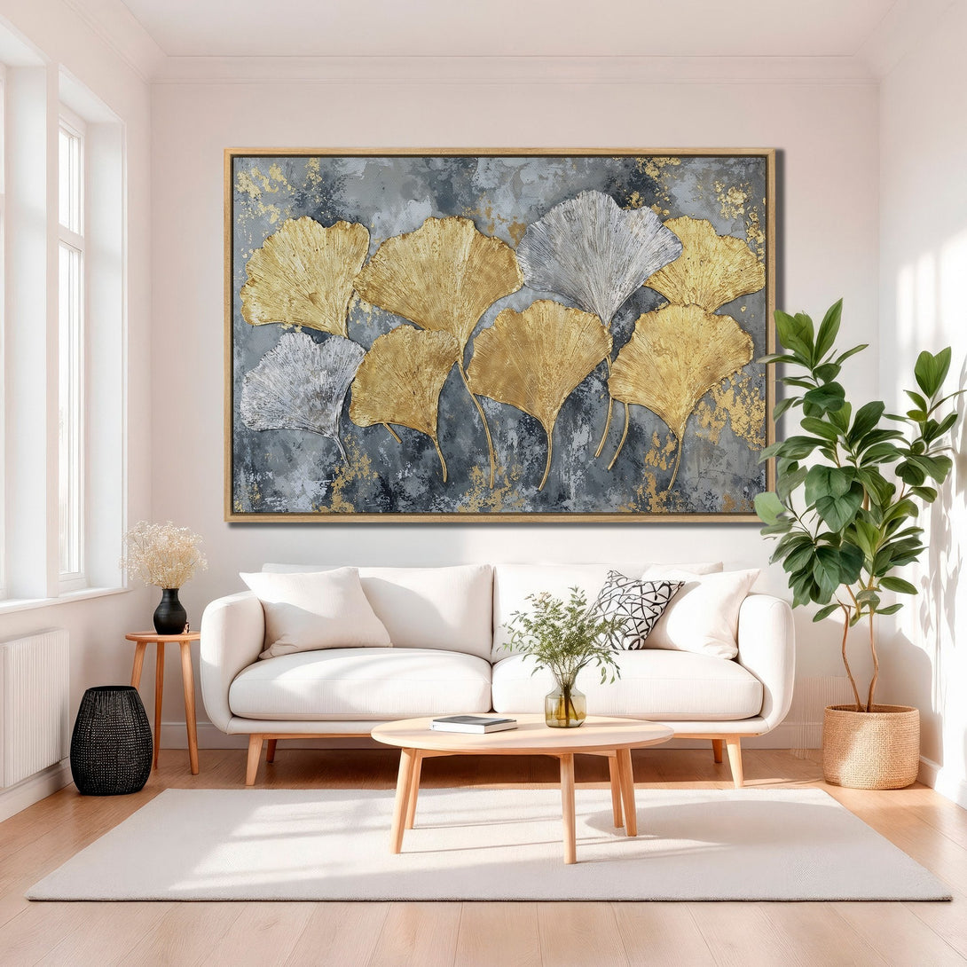 Framed Wall Art featuring gold and silver ginkgo leaves on a gray backdrop. Modern abstract style with a neutral color palette, perfect for home decor.