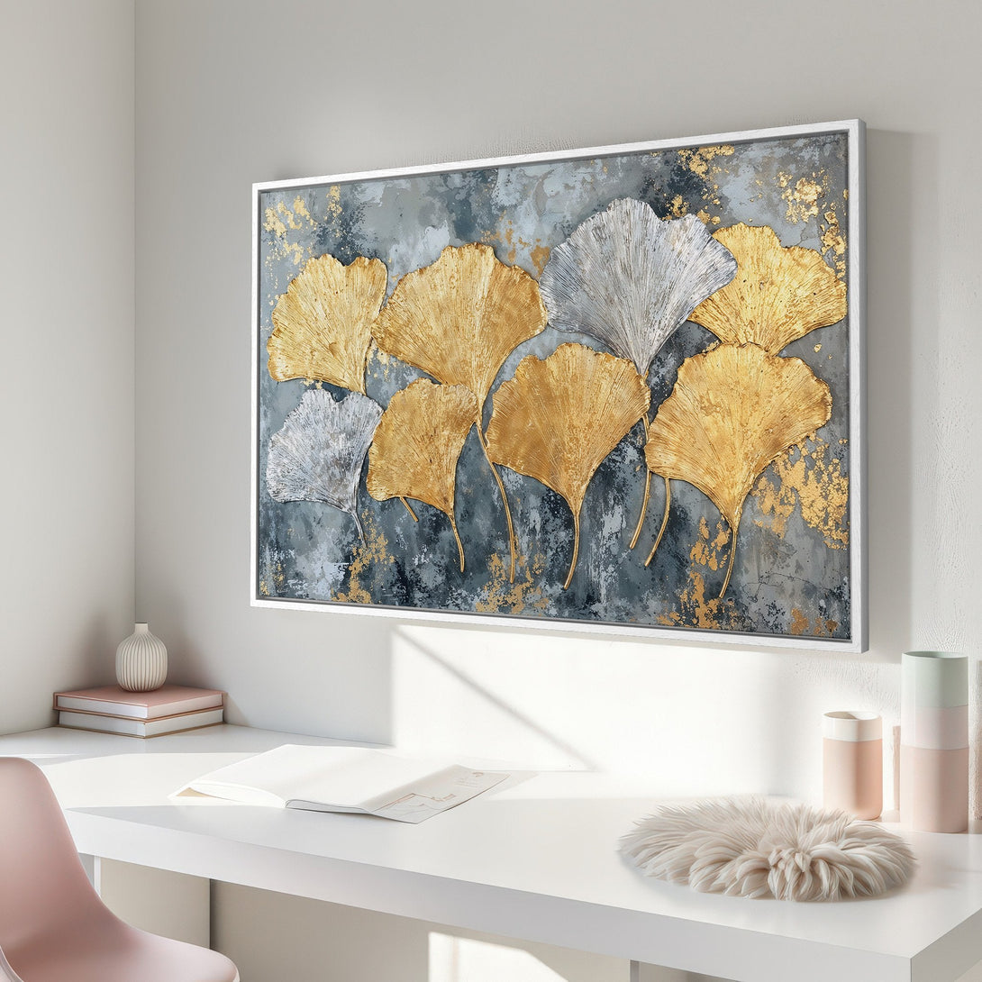 Framed Wall Art featuring gold and silver ginkgo leaves on a textured gray background. Modern art with a touch of luxury, perfect for home decor.