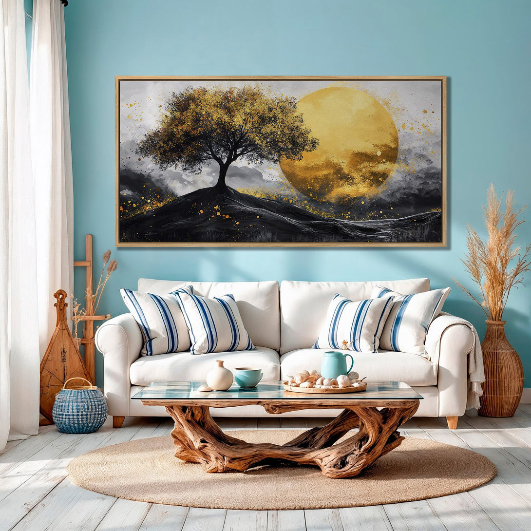 Framed Wall Art: Abstract tree and sun painting with gold and black accents, displayed in a modern living room with a blue color palette.