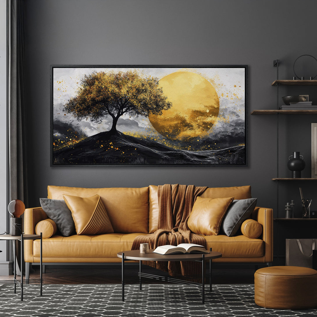 Framed Wall Art featuring a golden tree against a warm yellow moon, in an abstract style with a black, gold, and gray color palette. Perfect for modern decor.