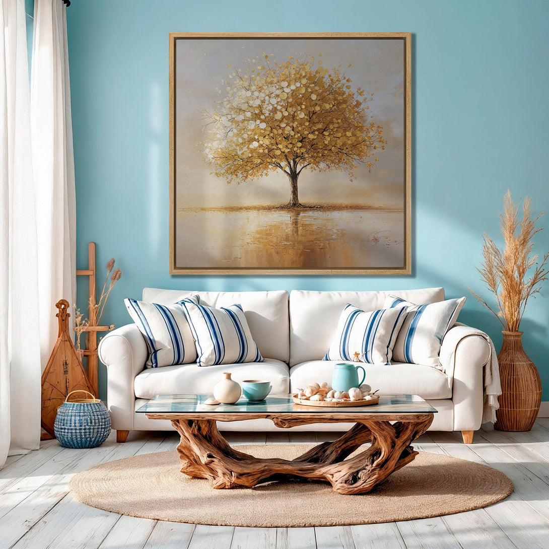 Framed Wall Art featuring a golden tree painting. Warm, neutral color palette with a touch of blue, perfect for adding a touch of nature to your living room.