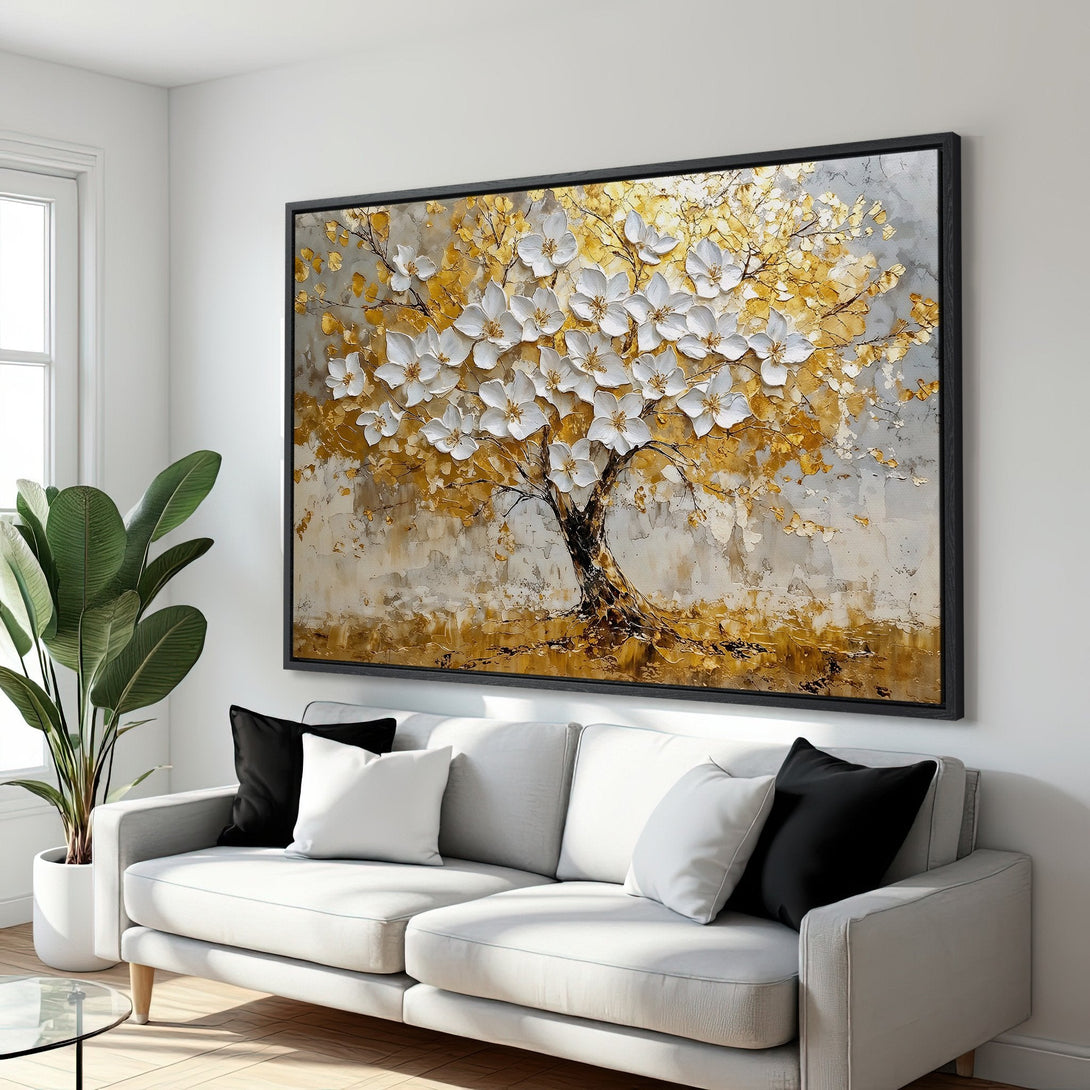 Framed Wall Art: Stunning gold and white tree painting in a modern living room. Textured art with a neutral color palette, perfect for home decor.