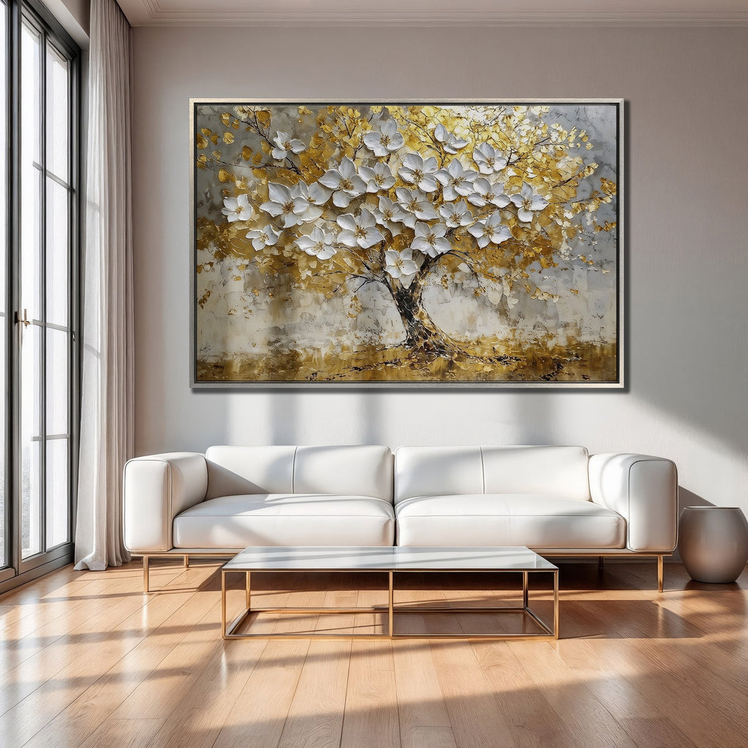Framed Wall Art of a tree with white flowers and gold leaves. Modern abstract style, neutral color palette. Perfect for living room decor.