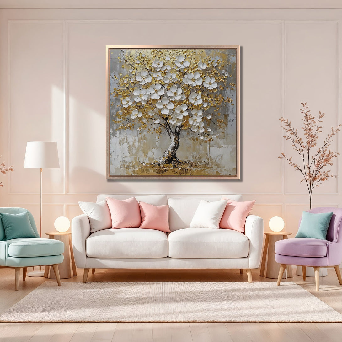 Framed Wall Art featuring a textured tree painting with gold and white blossoms. Perfect for adding a touch of elegance with its soft pastel palette.