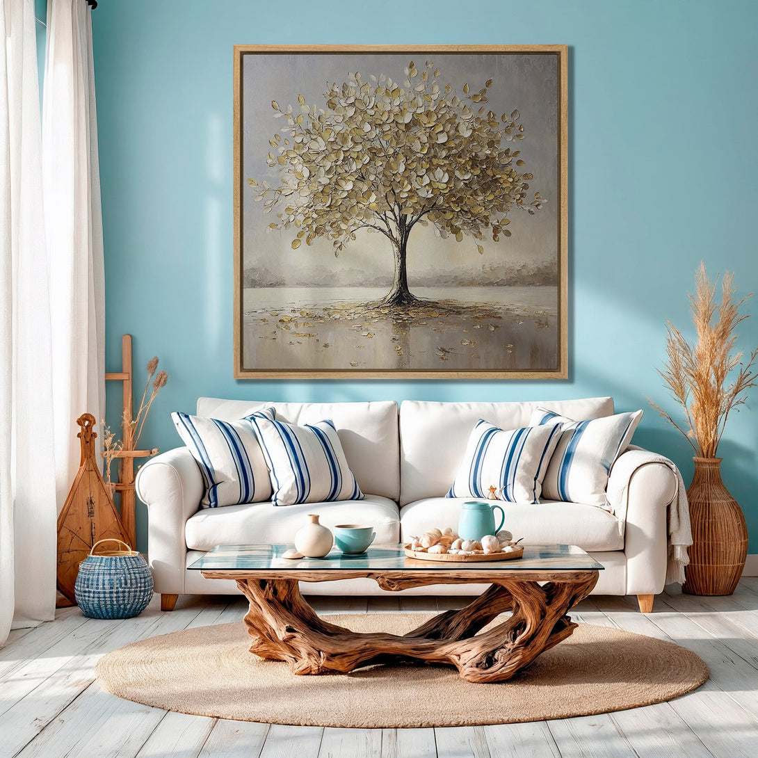 Framed Wall Art: Abstract tree painting in a coastal living room. Neutral and gold tones against a blue wall. Perfect for modern home decor.