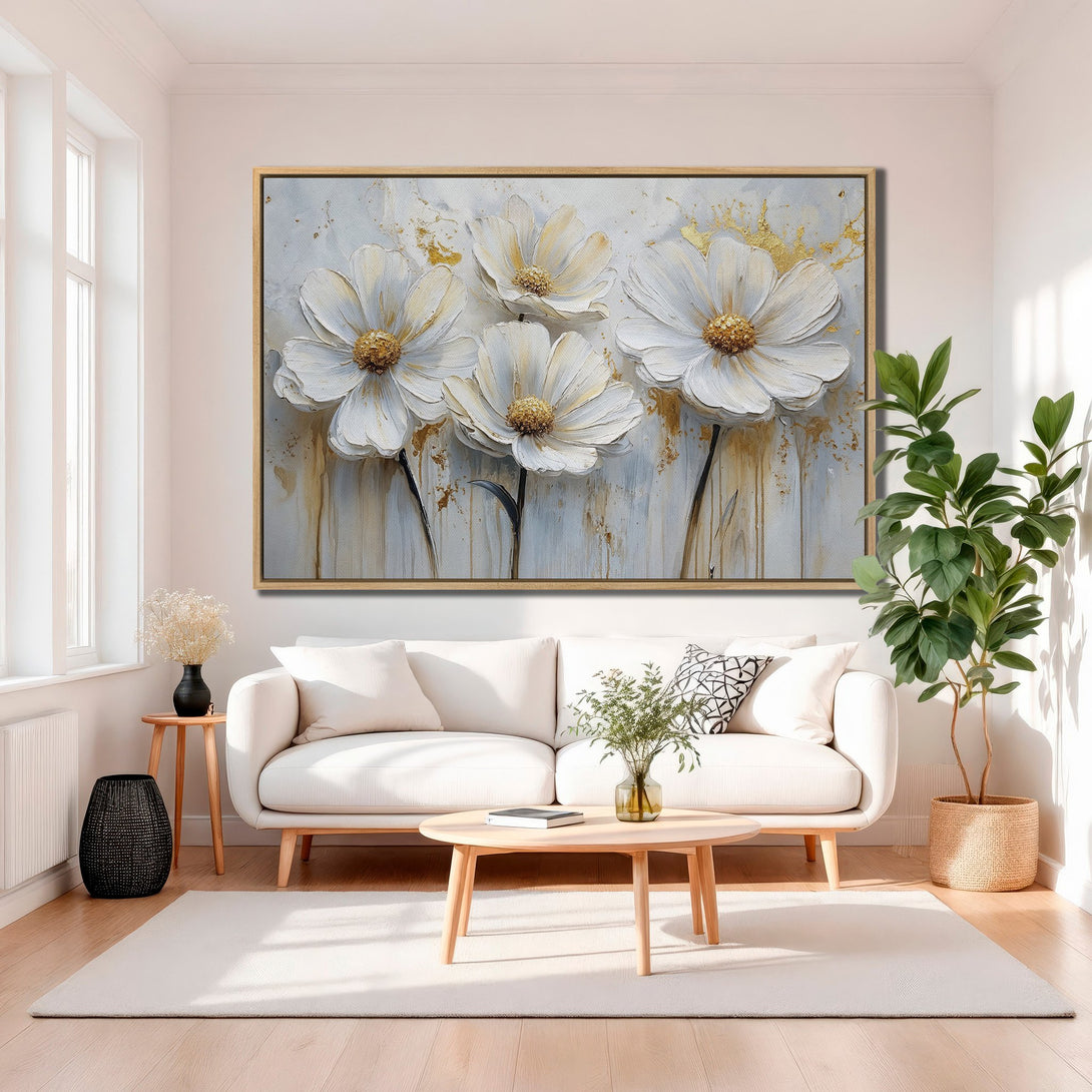 Framed Wall Art: Large floral canvas print in a modern interior. Features white flowers with gold accents on a neutral, light color palette.