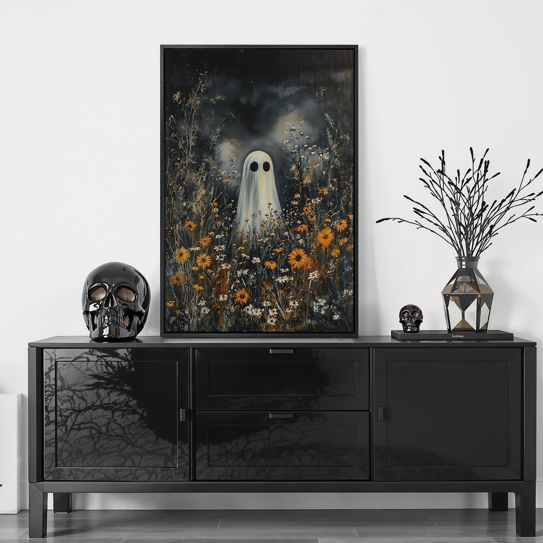 Framed Wall Art featuring a ghostly figure in a field of flowers. Dark, moody style with a black, white, and orange color palette. Perfect Halloween decor!