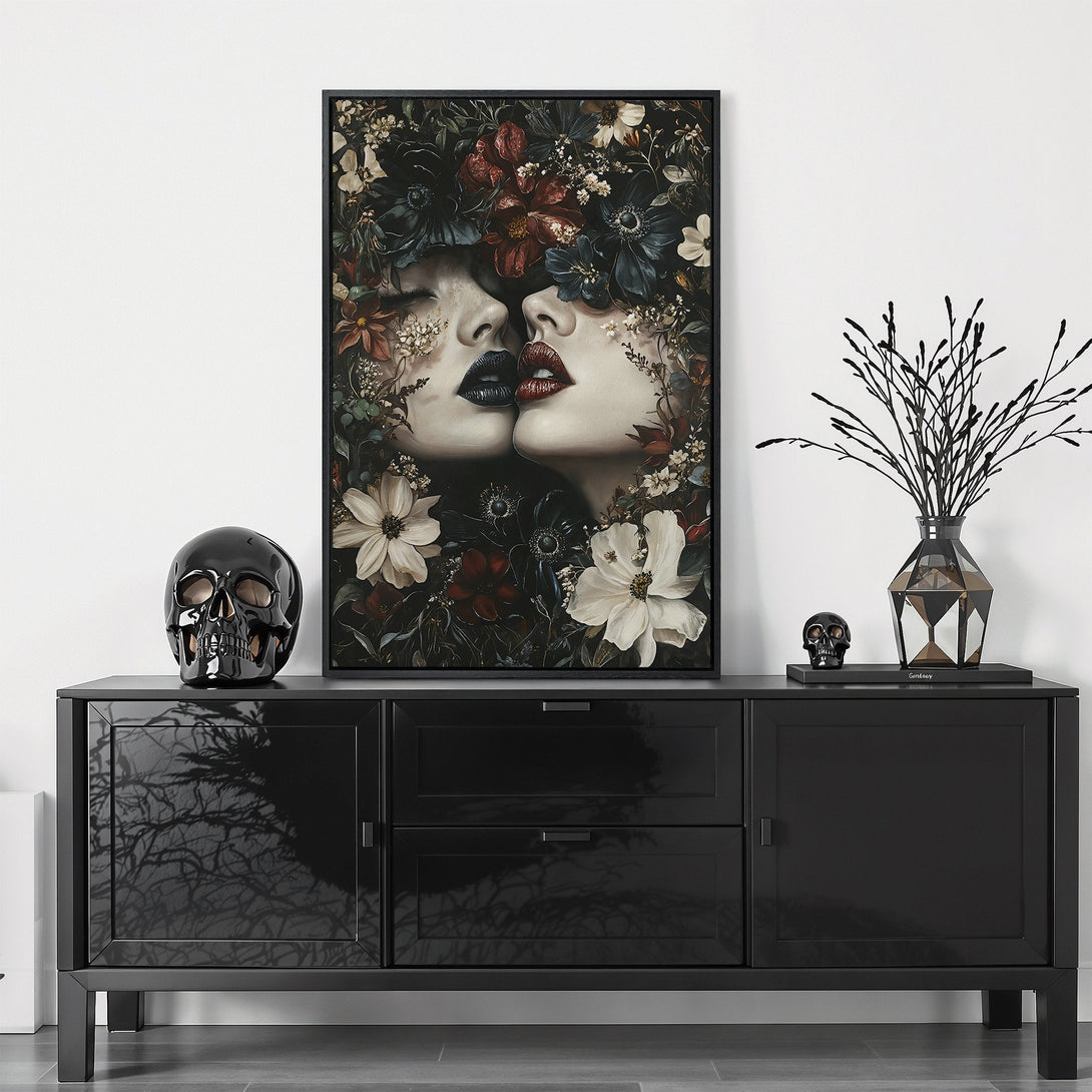 Framed Wall Art: Romantic portrait of two women kissing, surrounded by flowers. Moody, dark aesthetic with red, white, and black color palette. Elevate your space!