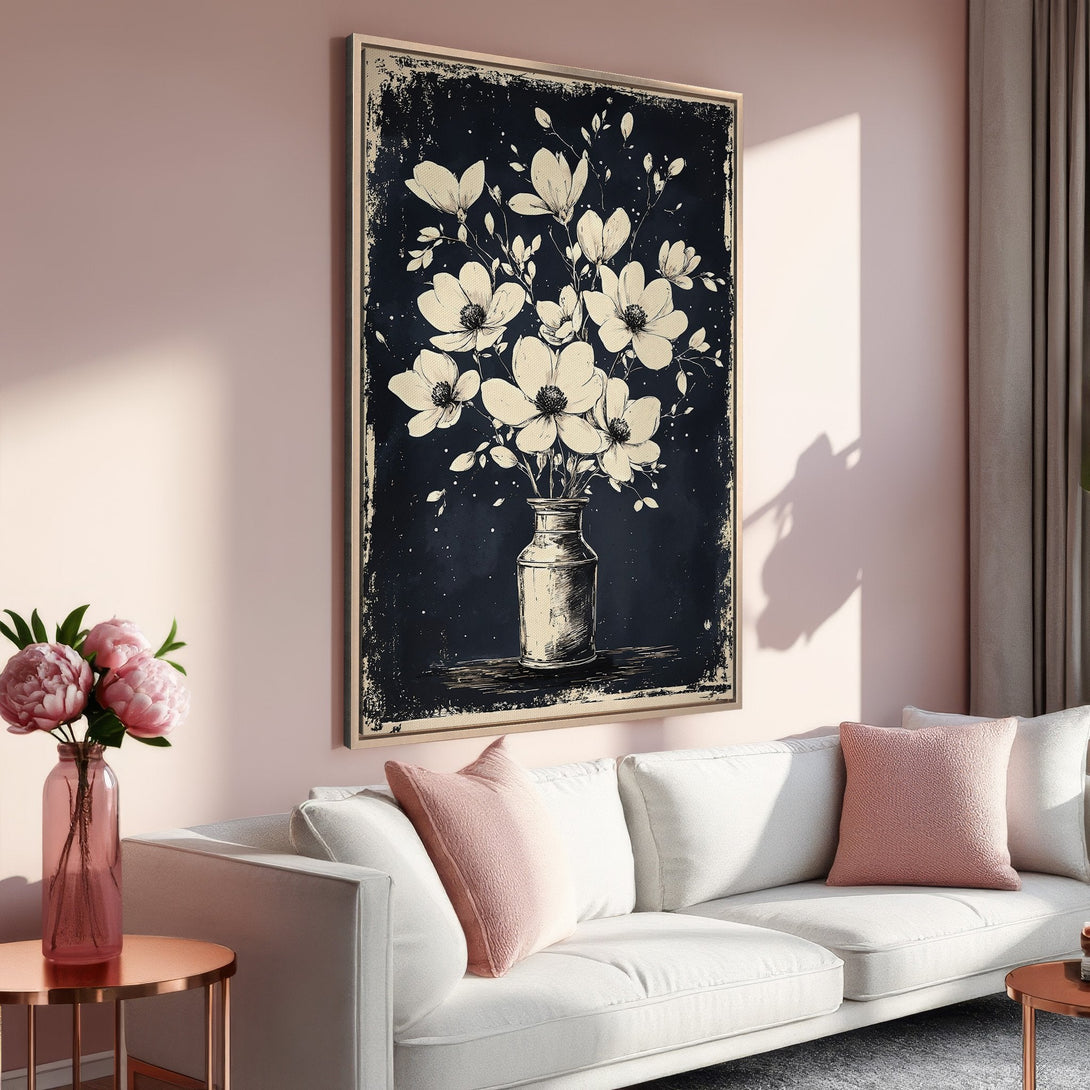 Framed Wall Art featuring a vintage floral illustration in black and cream, displayed in a modern living room with a pink and neutral color palette.