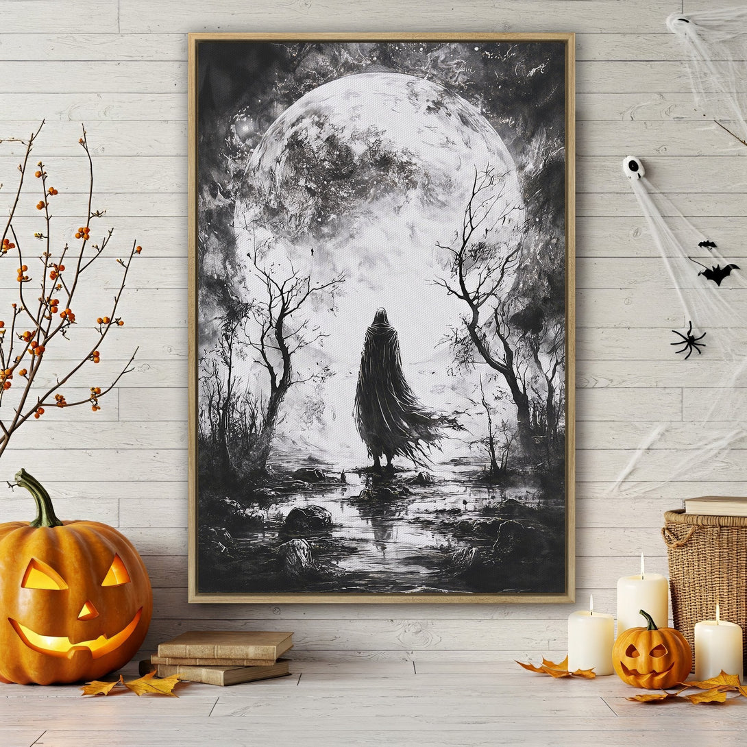 Framed Wall Art: Spooky black and white landscape canvas print with a cloaked figure, full moon, and eerie trees. Perfect Halloween decor!