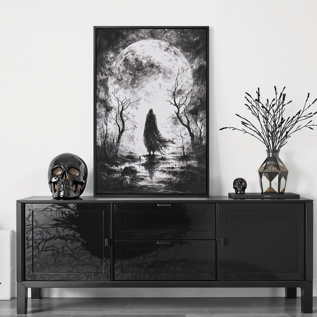 Framed Wall Art featuring a haunting figure under a full moon. Gothic style, black and white color palette. Perfect for adding a touch of mystery to your space.