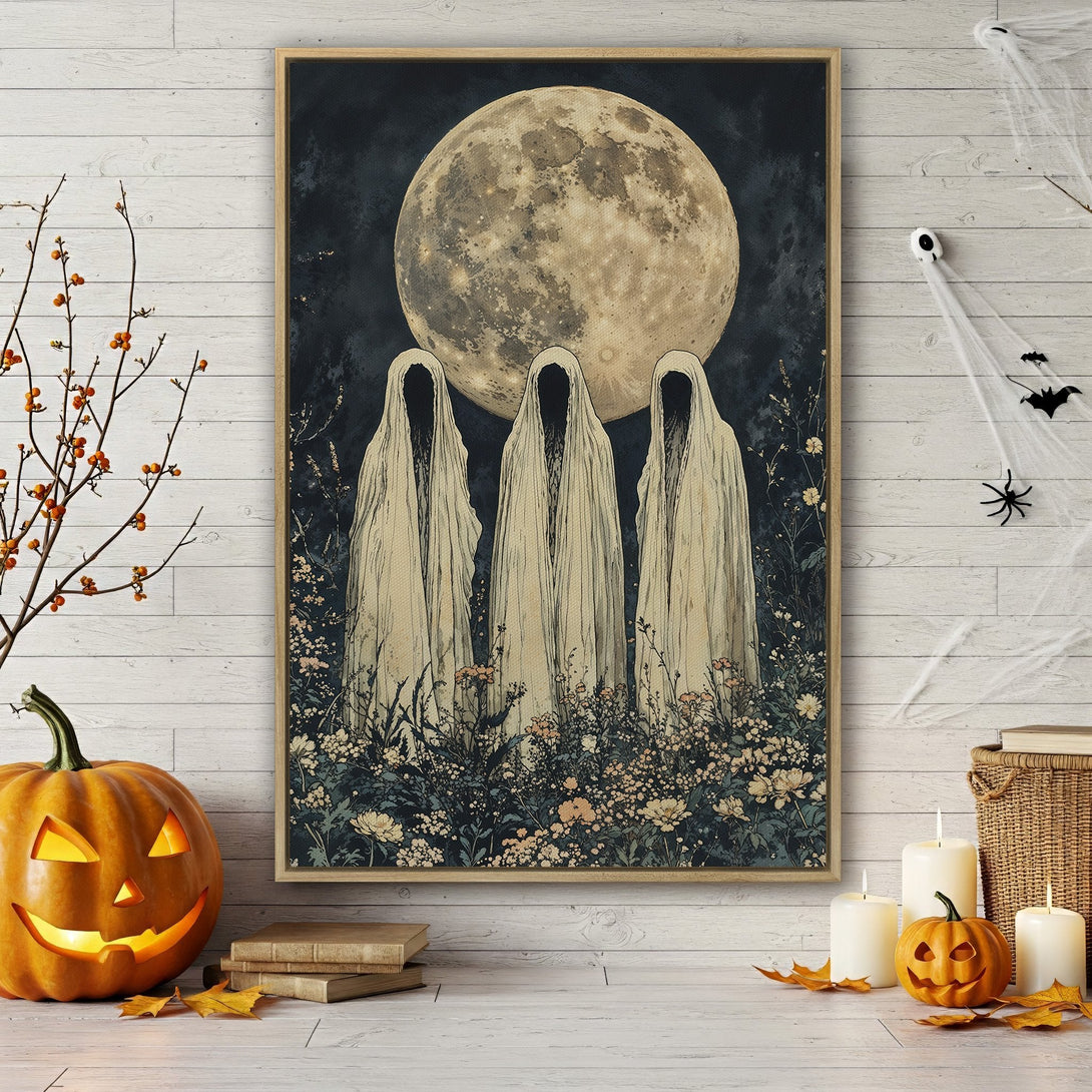 Framed Wall Art featuring a spooky, vintage-style illustration of three cloaked figures under a full moon. Dark blue, cream, and beige color palette. Perfect Halloween decor!