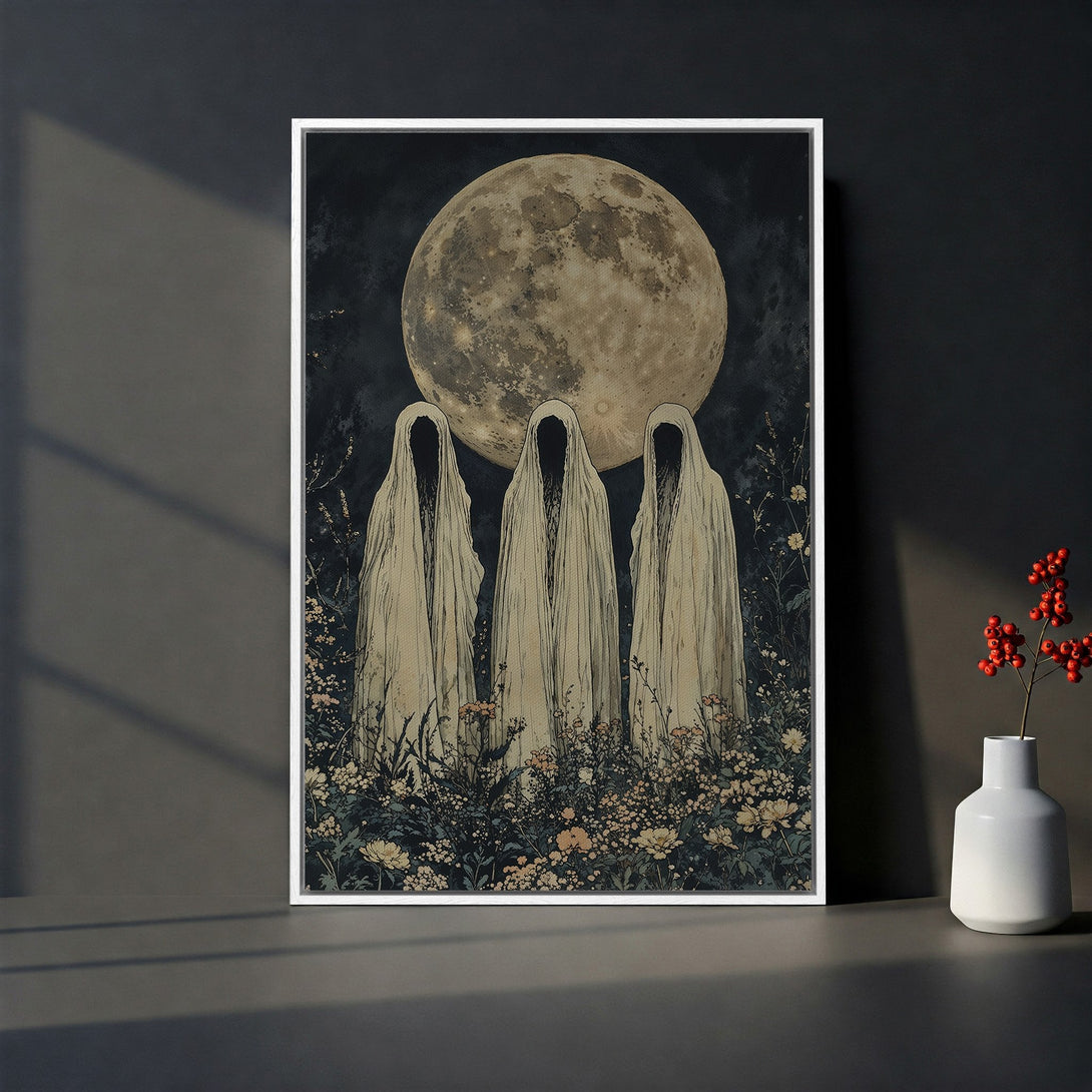 Framed Wall Art featuring a gothic illustration of cloaked figures under a full moon. Moody, vintage style with a dark, muted color palette. Perfect for Halloween decor.