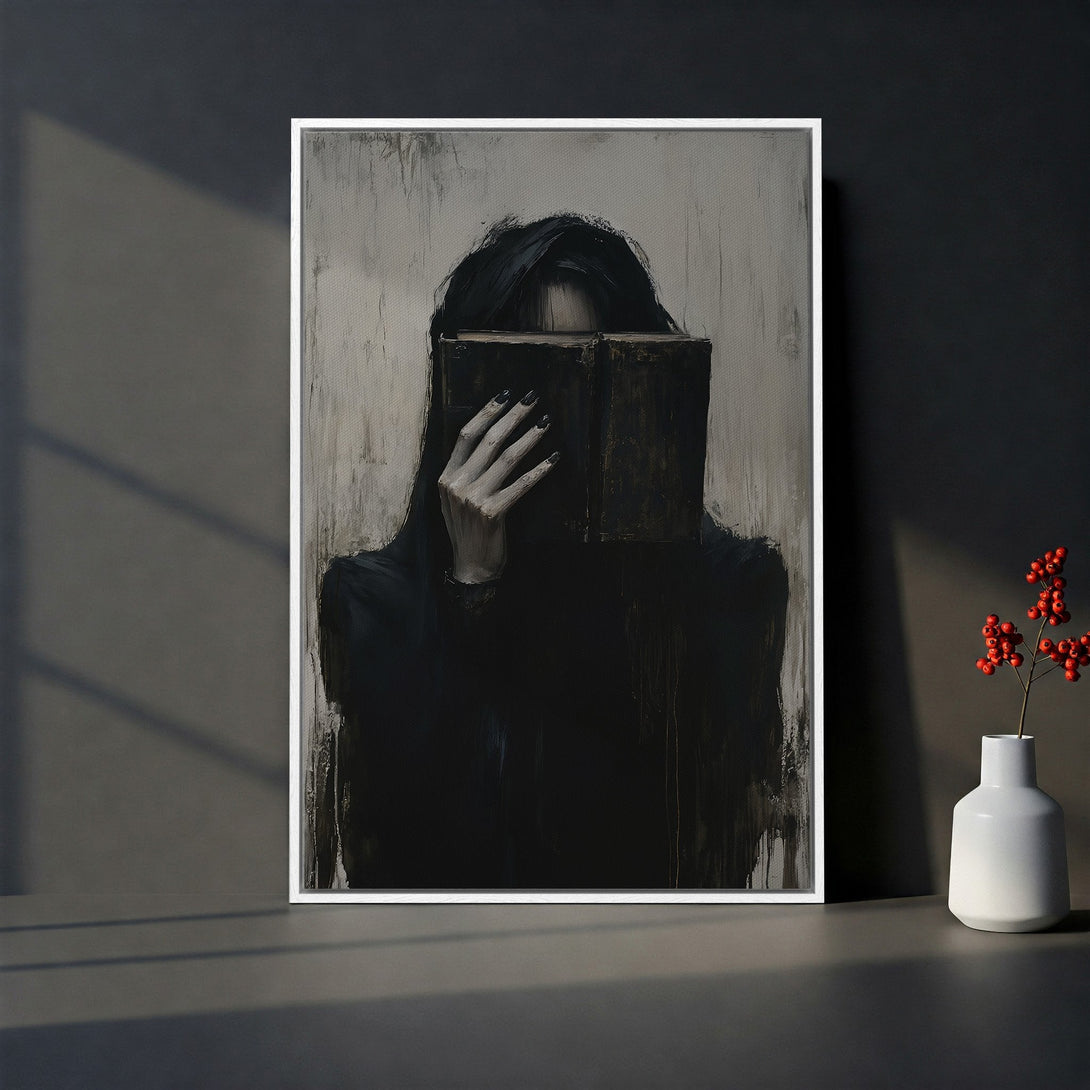 Framed Wall Art featuring a mysterious figure with a book, in a dark, moody style with a grayscale and black color palette. Perfect for modern decor.