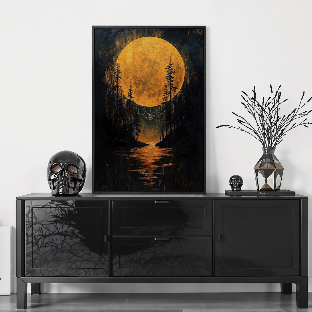 Framed Wall Art featuring a surreal landscape with a large golden moon. Dark, moody color palette with black, gold, and orange tones. Perfect for adding a touch of mystery.