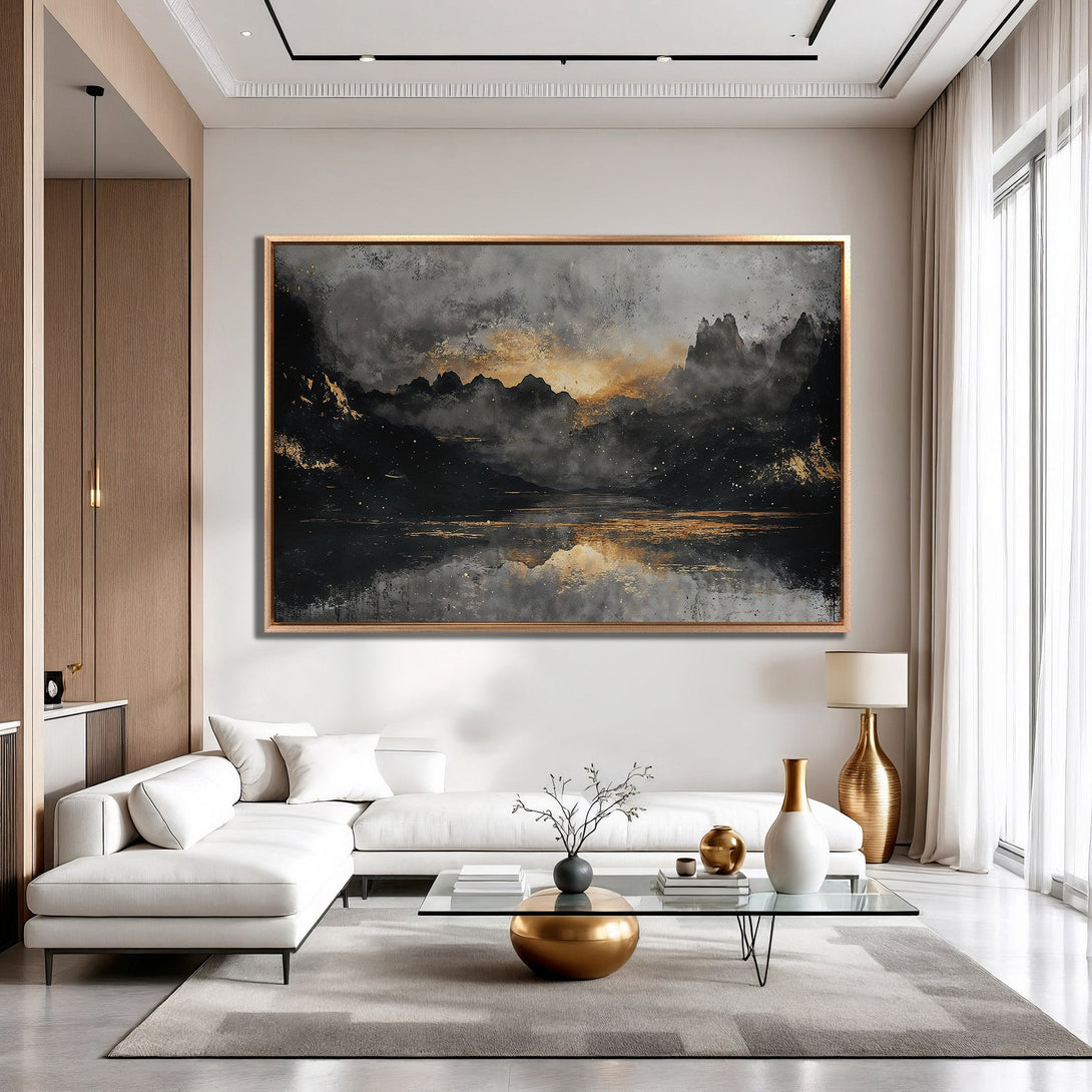 Framed Wall Art: Abstract landscape canvas print in a modern living room. Features a moody black, gray, and gold color palette. Elevate your space with this stunning art.
