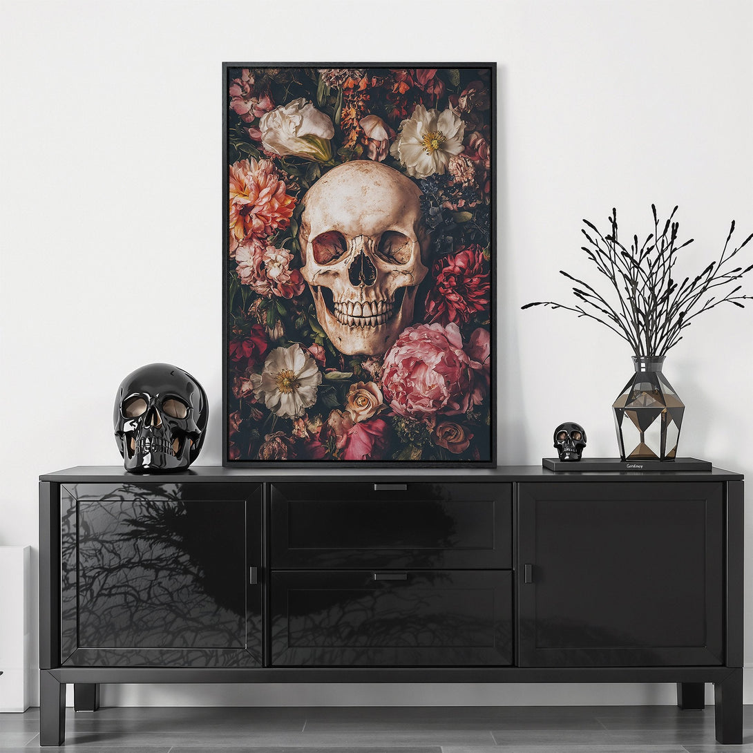 Framed Wall Art: Skull and floral Canvas Print in moody, gothic style. Features a dark, romantic color palette with pinks, reds, and creams. Perfect for adding a touch of edgy elegance.