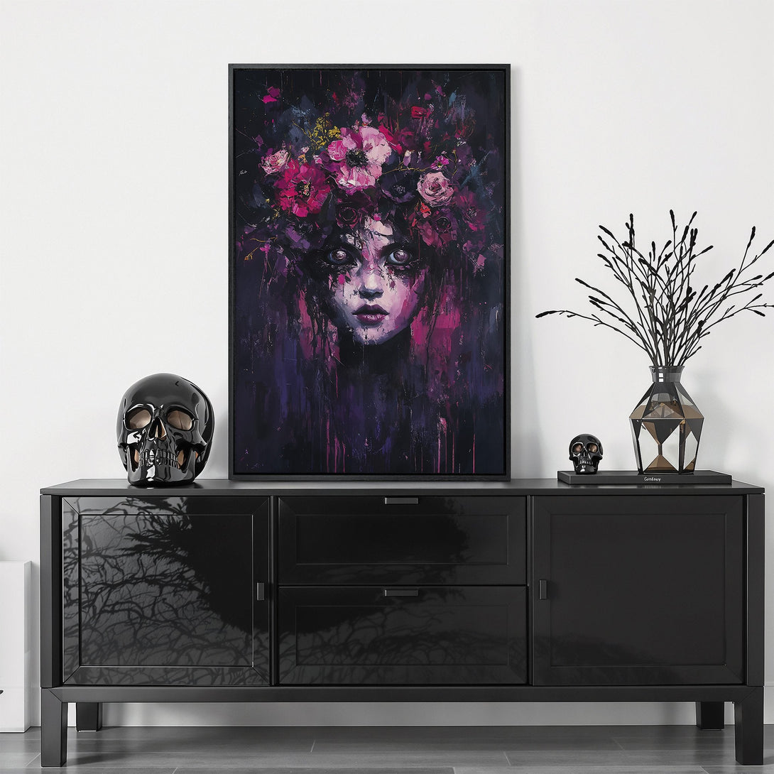 Framed Wall Art featuring a haunting portrait with a floral crown, in a dark, moody style with a purple and pink color palette. Perfect for gothic decor.
