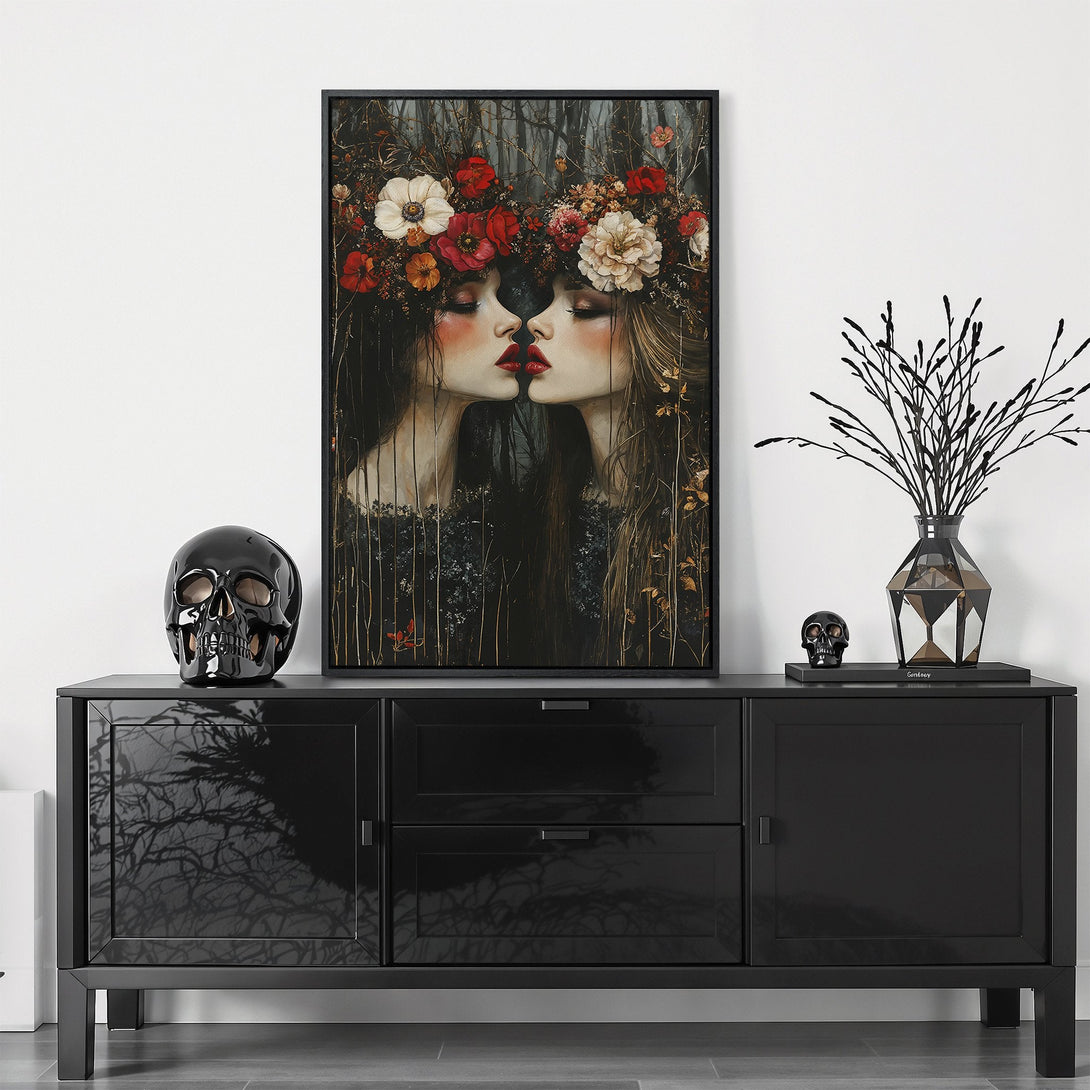 Framed Wall Art featuring a surreal portrait of two women with floral crowns, dark and moody color palette. Perfect for modern home decor.