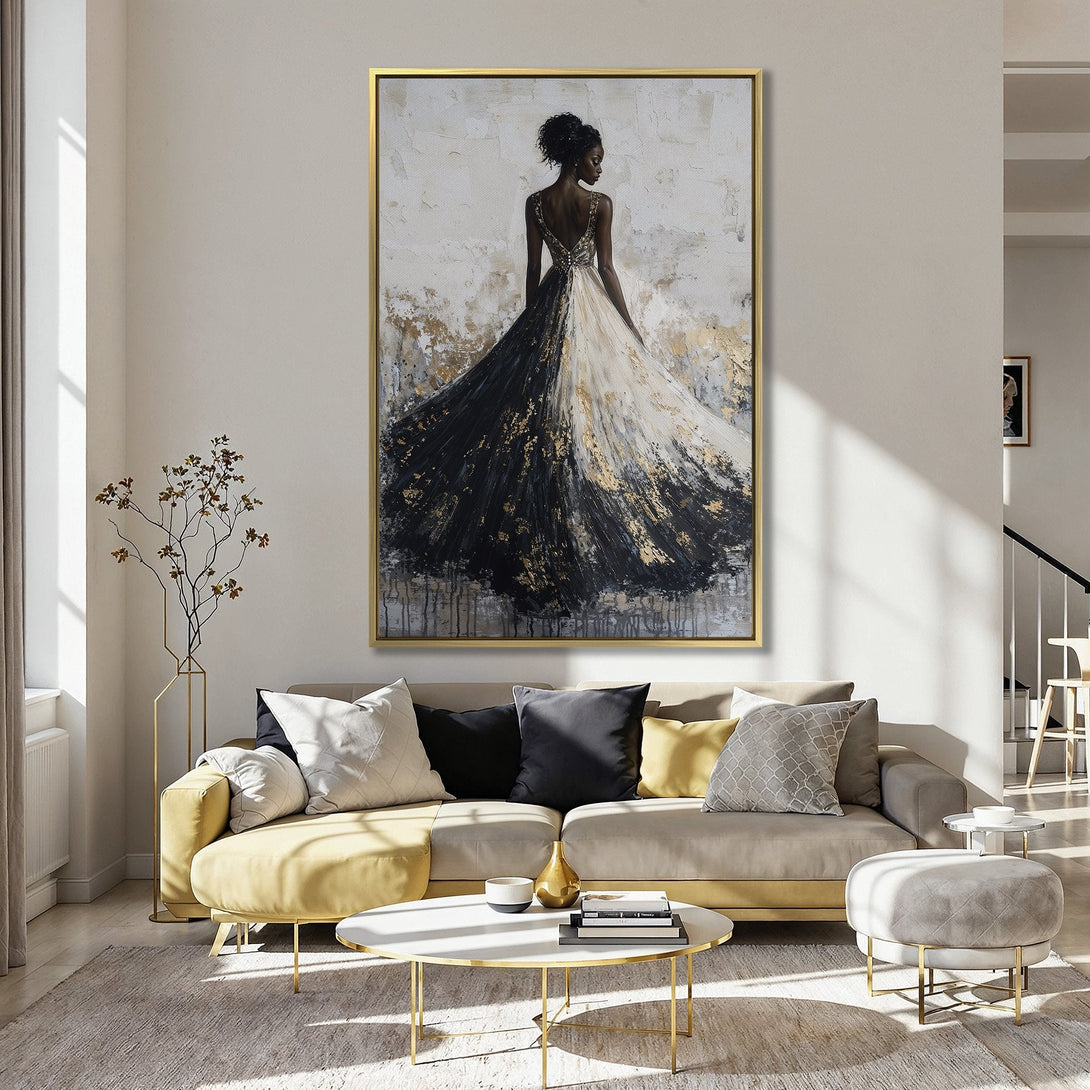 Elegant Canvas Print of a woman in a flowing black and white gown, gold accents, displayed in a stylish interior. Modern art with a neutral color palette.