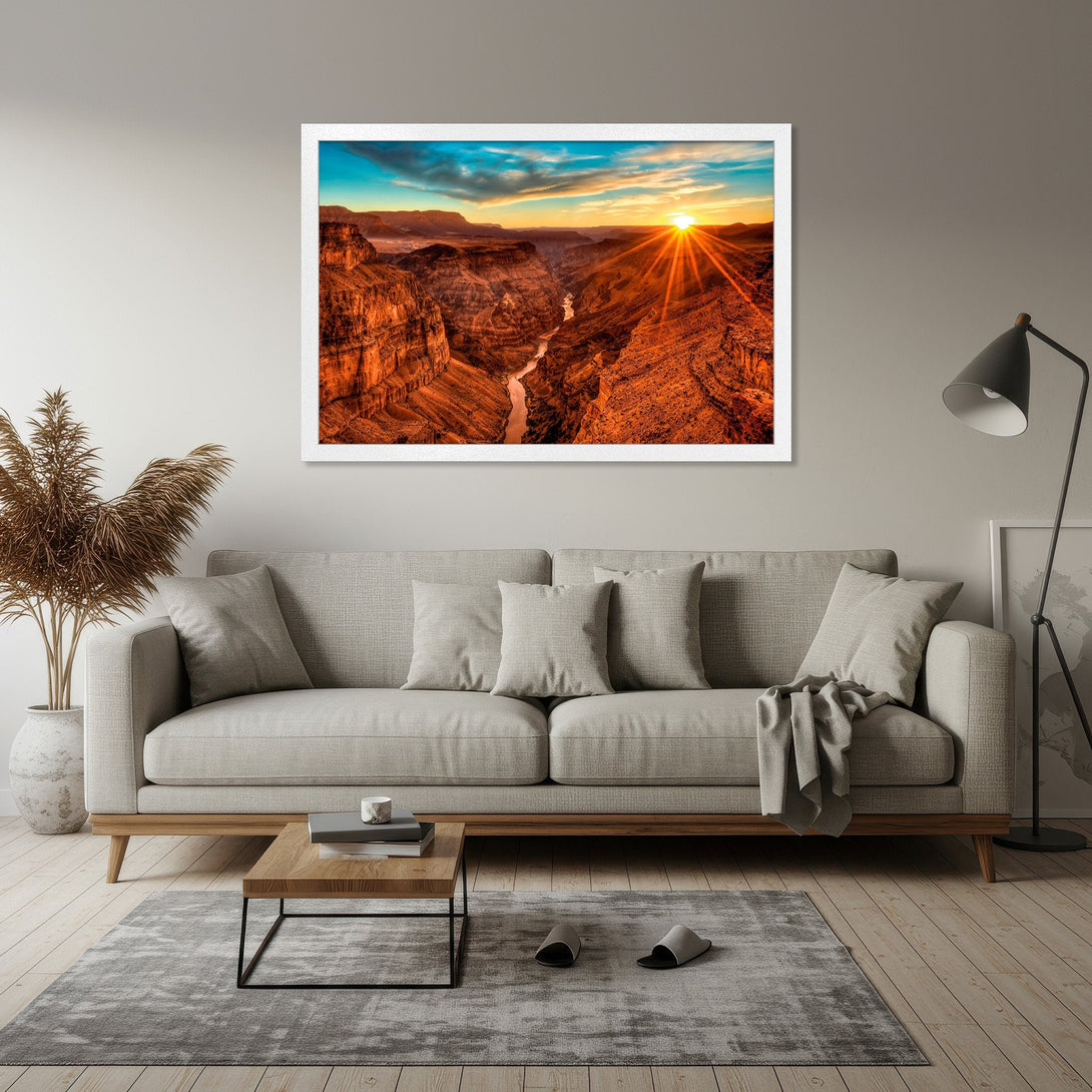 Framed Poster of Grand Canyon at Sunset. Vibrant landscape art with warm orange and blue hues. Perfect wall decor for any home.