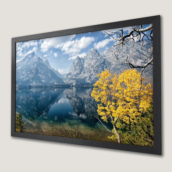 Framed Poster of a serene mountain lake scene with yellow foliage. Blue, green, and yellow color palette. Add nature's beauty to your space!