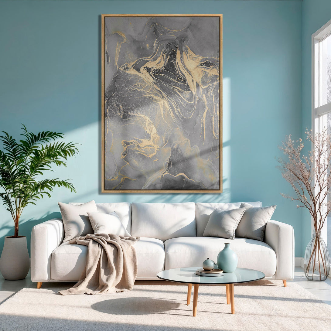 Framed Wall Art: Abstract gray and gold canvas print in a modern living room, featuring a calming blue and neutral color palette.