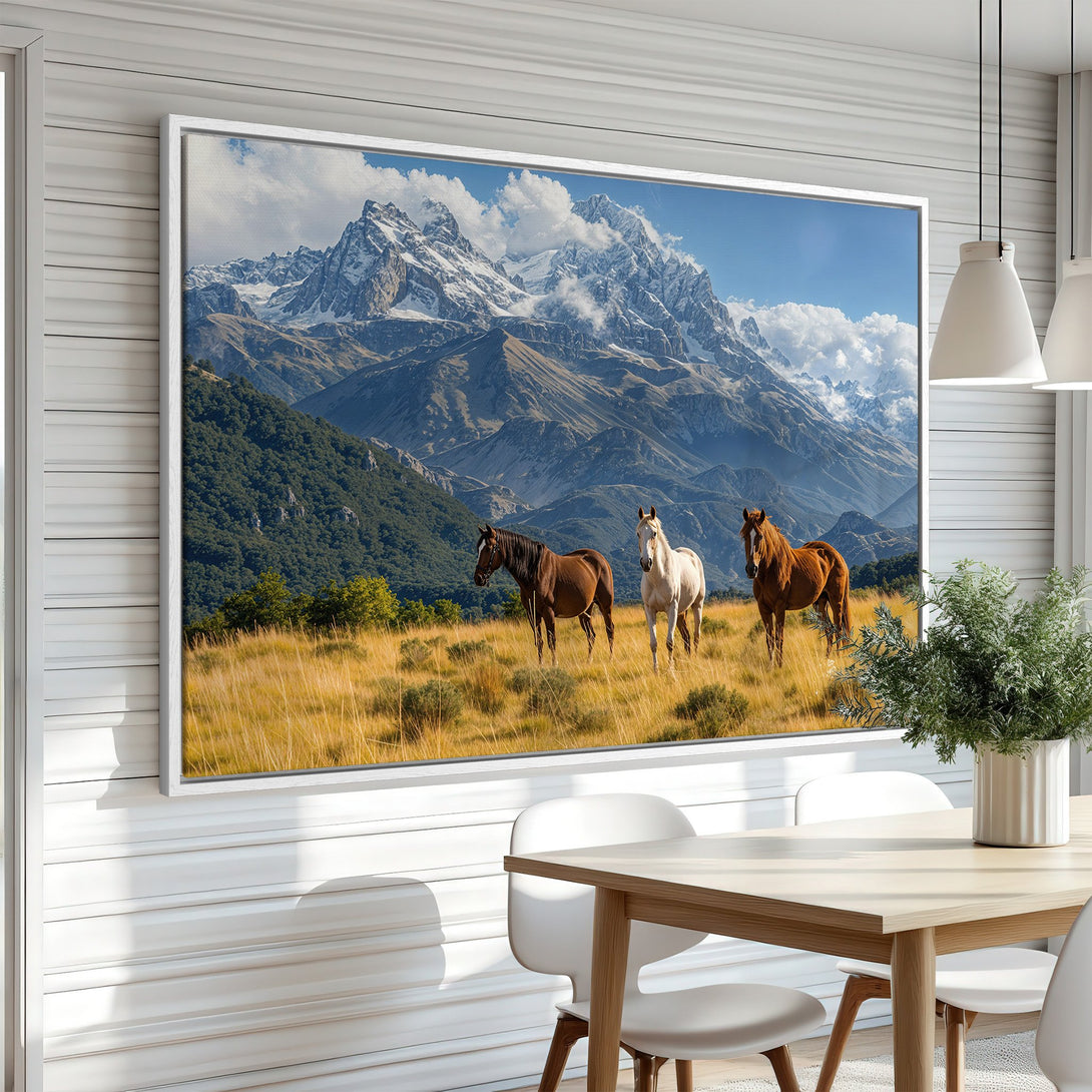 Framed Wall Art of horses in a mountain landscape. Earthy tones of brown, gold, and blue create a stunning nature scene for your home decor.