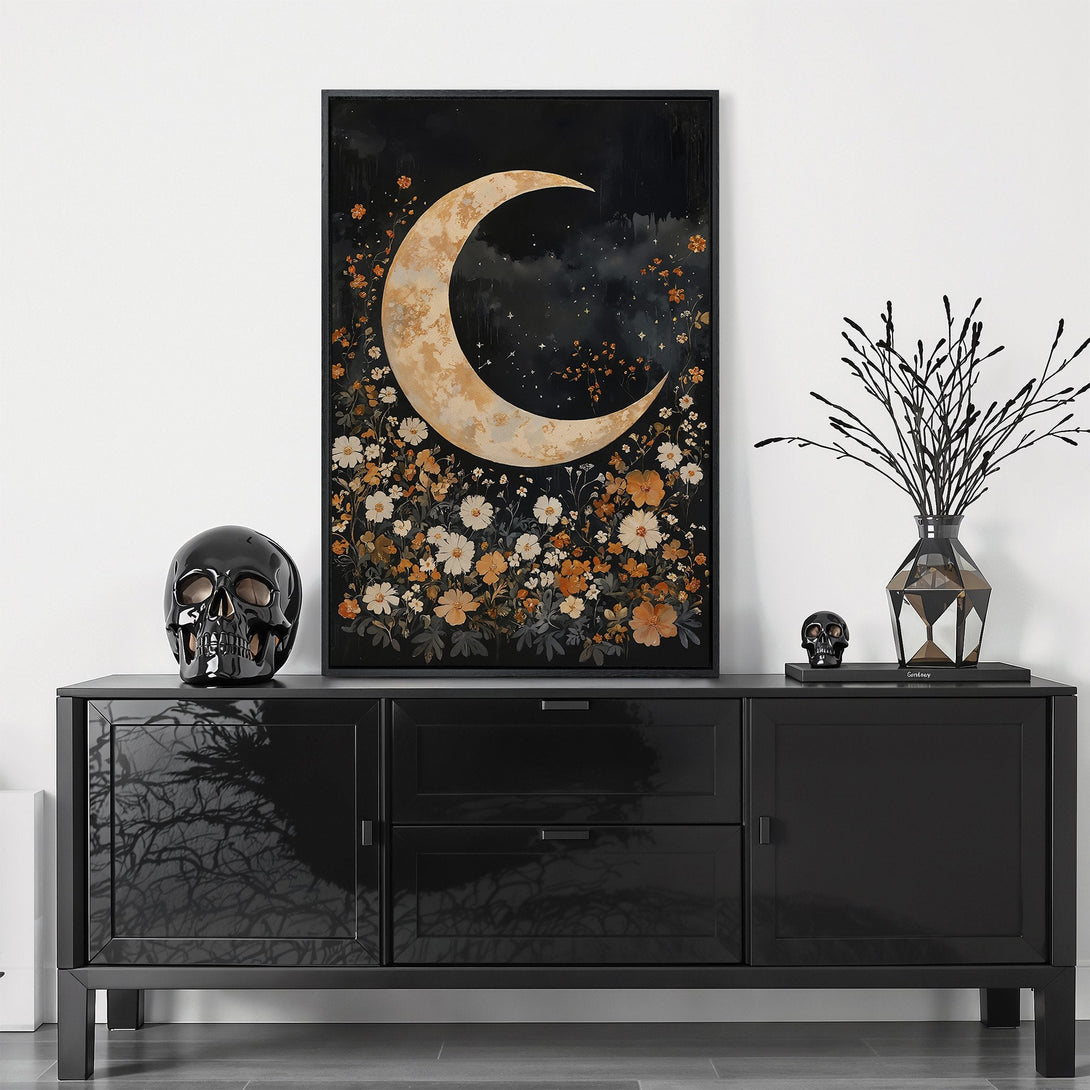 Framed Wall Art featuring a crescent moon and floral design in a dark, moody color palette. Perfect for adding a touch of gothic elegance to your home.