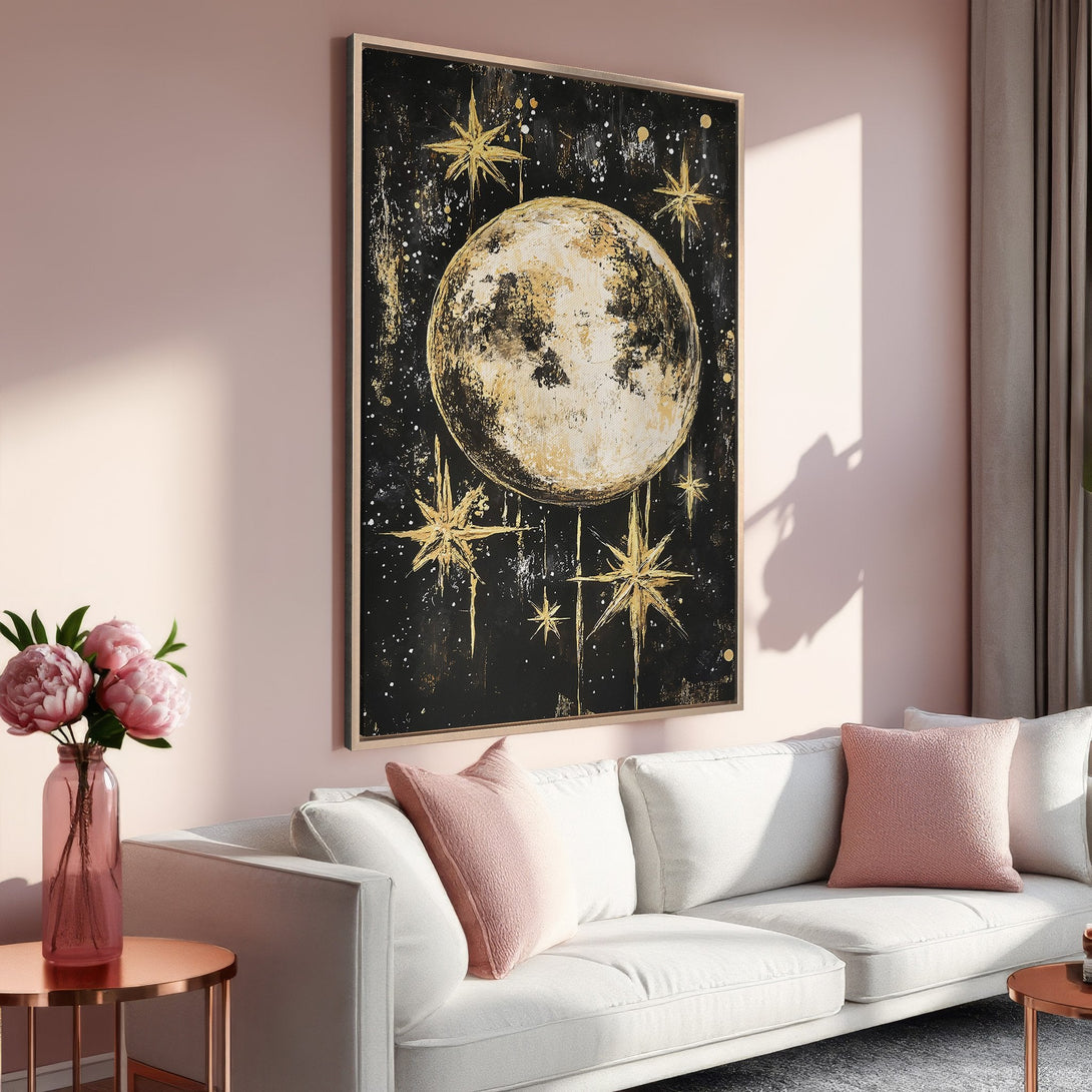 Framed Wall Art: Celestial moon and stars painting in gold, black, and white. Modern art for living room decor. Pink and gold color palette.