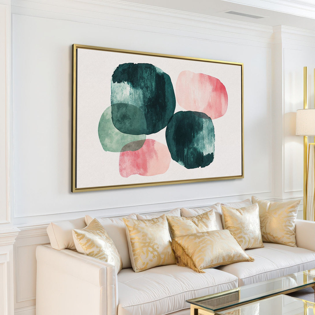 Abstract watercolor Canvas Print in a modern living room. Features green and pink organic shapes on a white background. Perfect for minimalist decor.