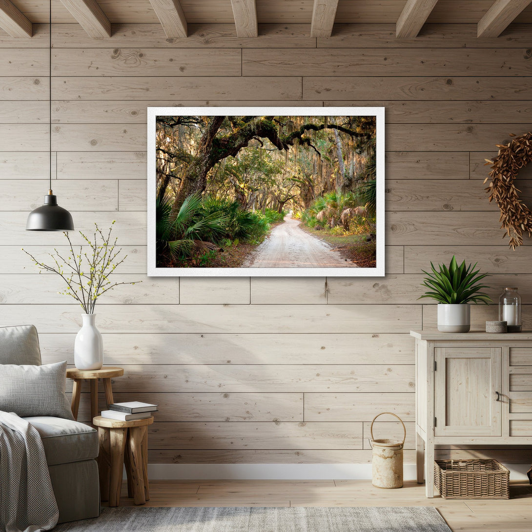 Framed Poster of a scenic road through a forest, warm color palette, perfect for home decor. Buy this beautiful Poster today!