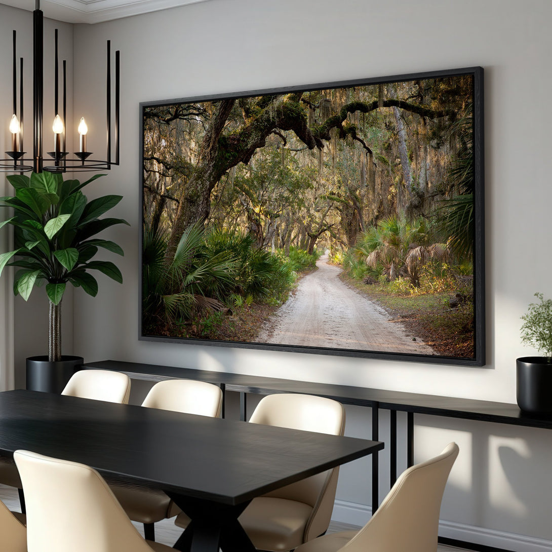 Framed Wall Art: Scenic road through lush forest. Earthy tones of green, brown, and gold create a warm, inviting atmosphere. Perfect for adding nature to your home.