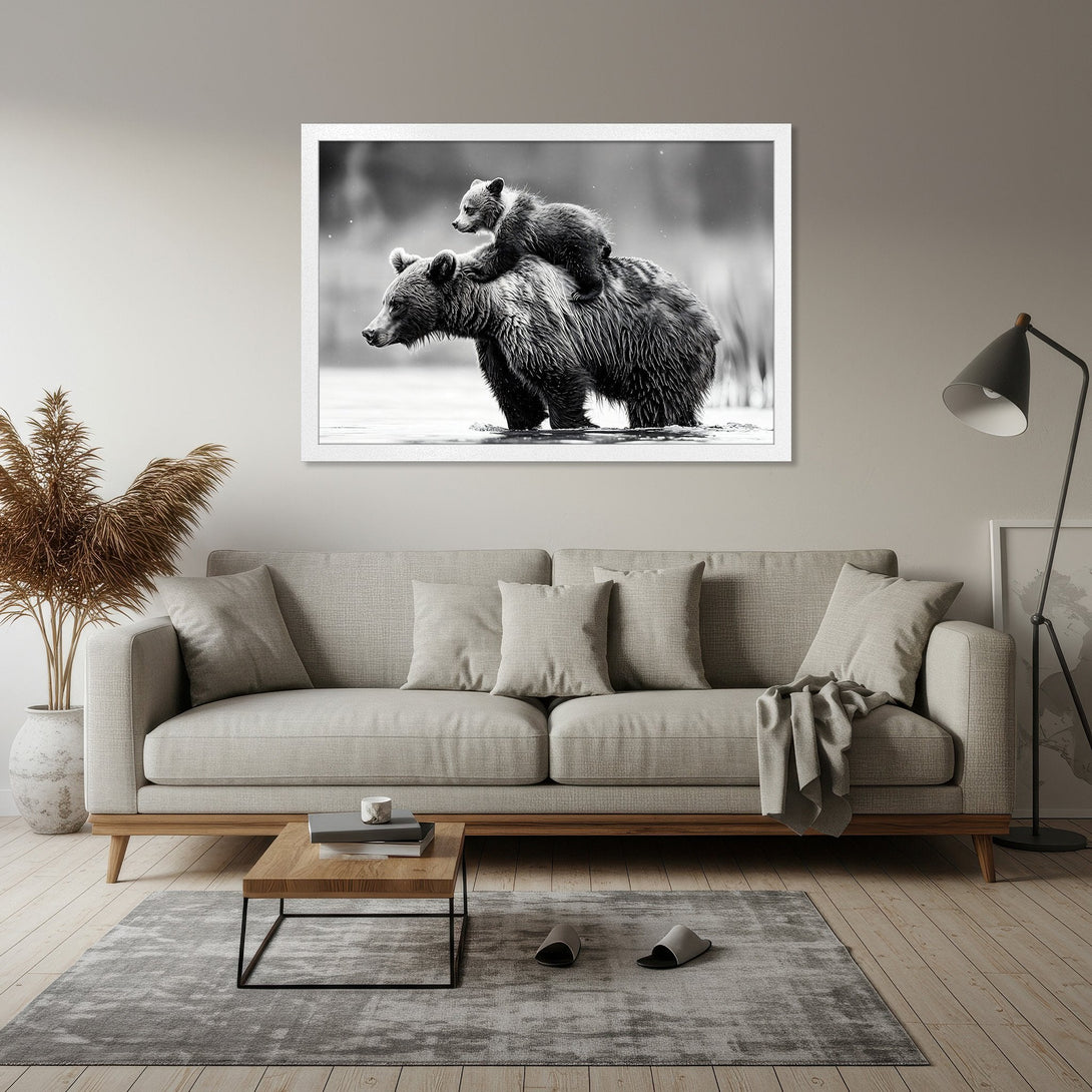Framed Poster of a bear cub on its mother's back, in a black and white style. Perfect wall art for your home!