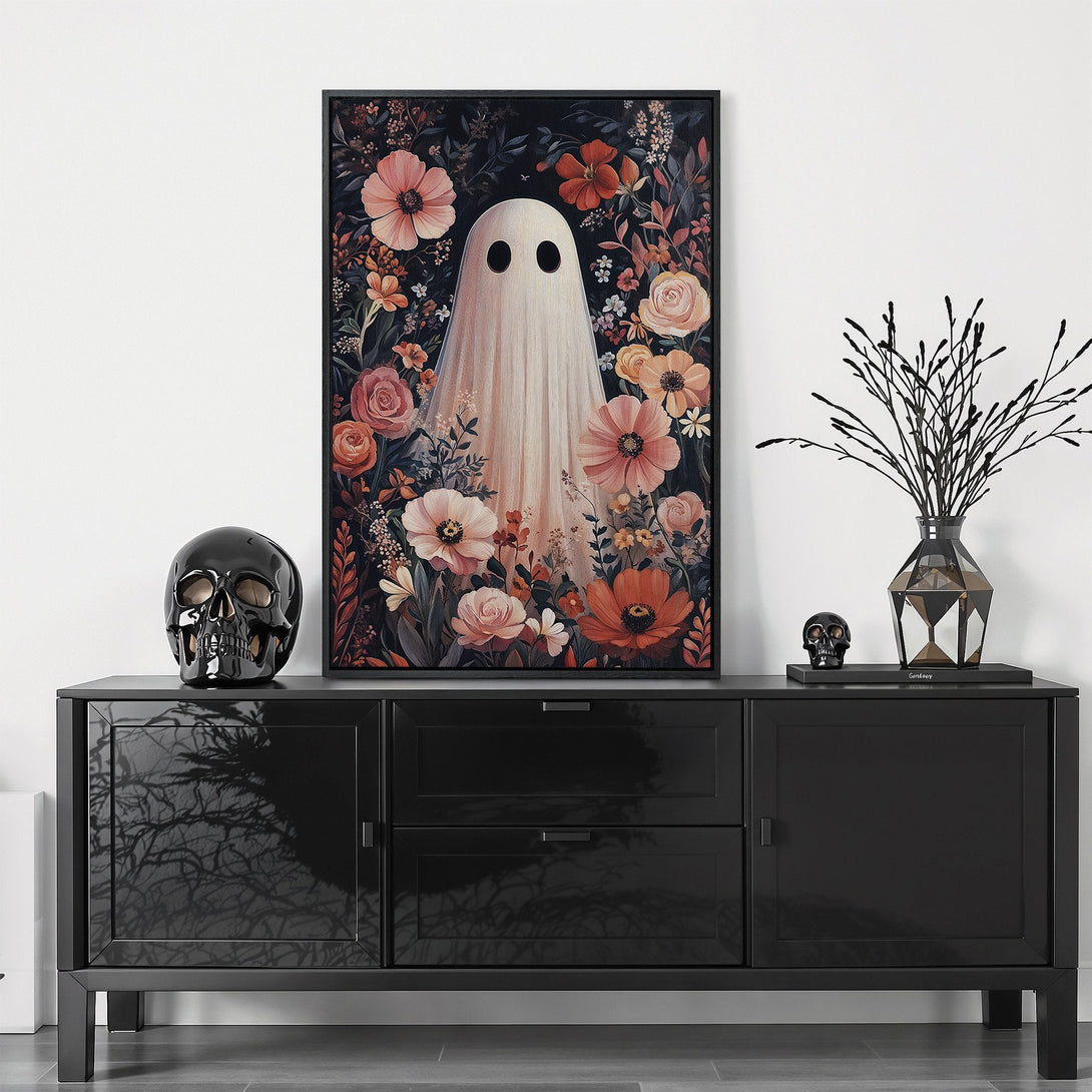 Framed Wall Art featuring a whimsical ghost surrounded by flowers in a dark, moody color palette. Perfect for adding unique style to your home!