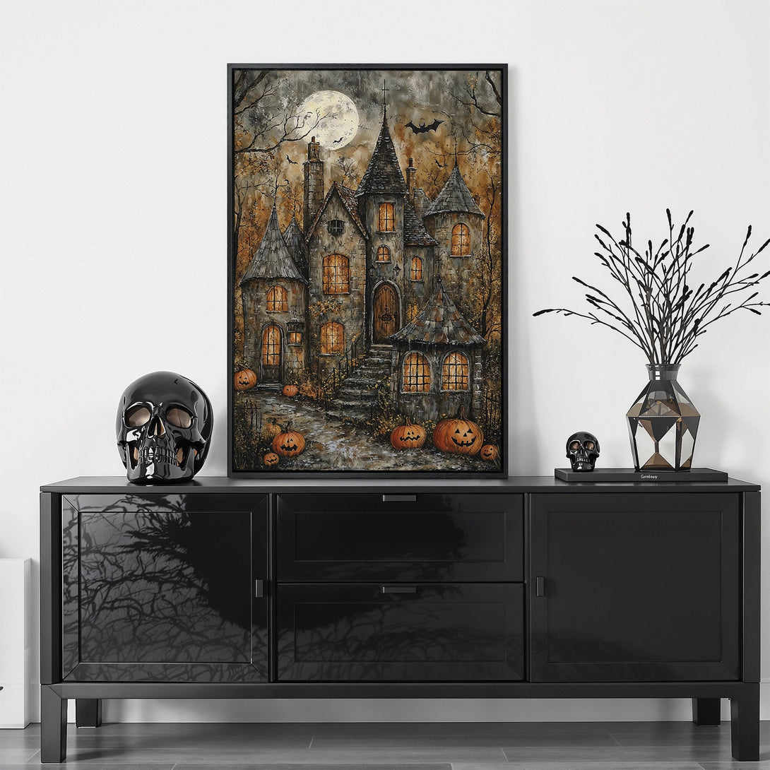 Framed Wall Art featuring a spooky castle scene with a full moon, in a moody, autumnal color palette. Perfect Halloween decor!