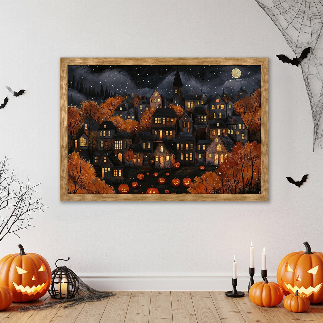 Framed Poster of a spooky Halloween town illustration in warm orange and dark blue tones. Perfect for fall decor!