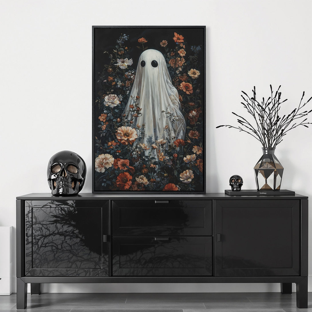 Framed Wall Art featuring a whimsical ghost in a floral garden. Gothic style with a dark, moody color palette of blacks, oranges, and whites. Perfect for Halloween decor.