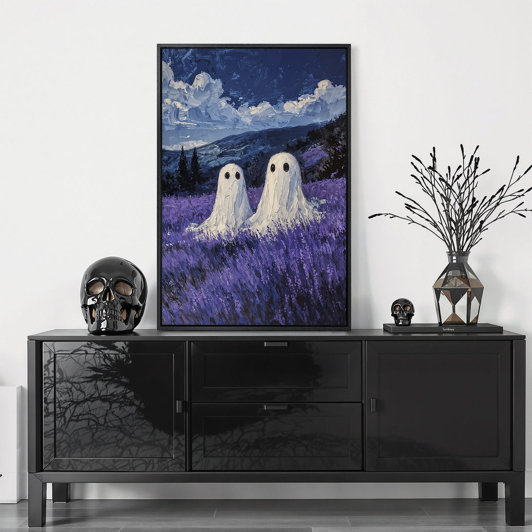 Framed Wall Art featuring whimsical ghost painting in a lavender field. Moody blue and purple color palette. Perfect for Halloween decor.