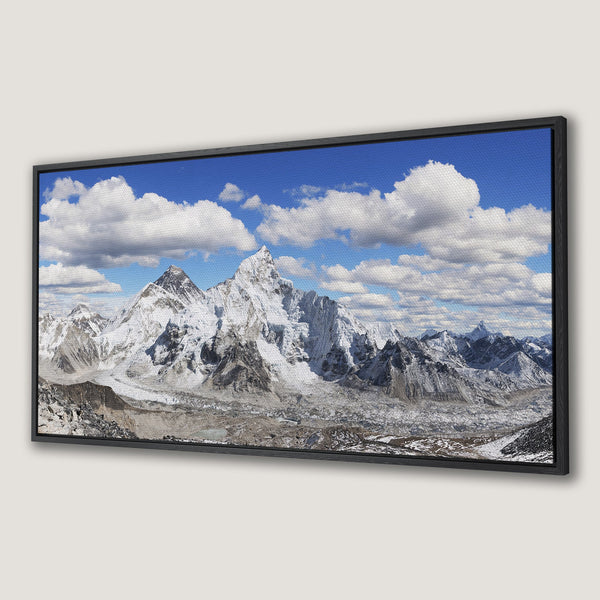 Framed Wall Art: Stunning mountain landscape canvas print. Blue sky, white clouds, and snow-capped peaks. Perfect for nature lovers.