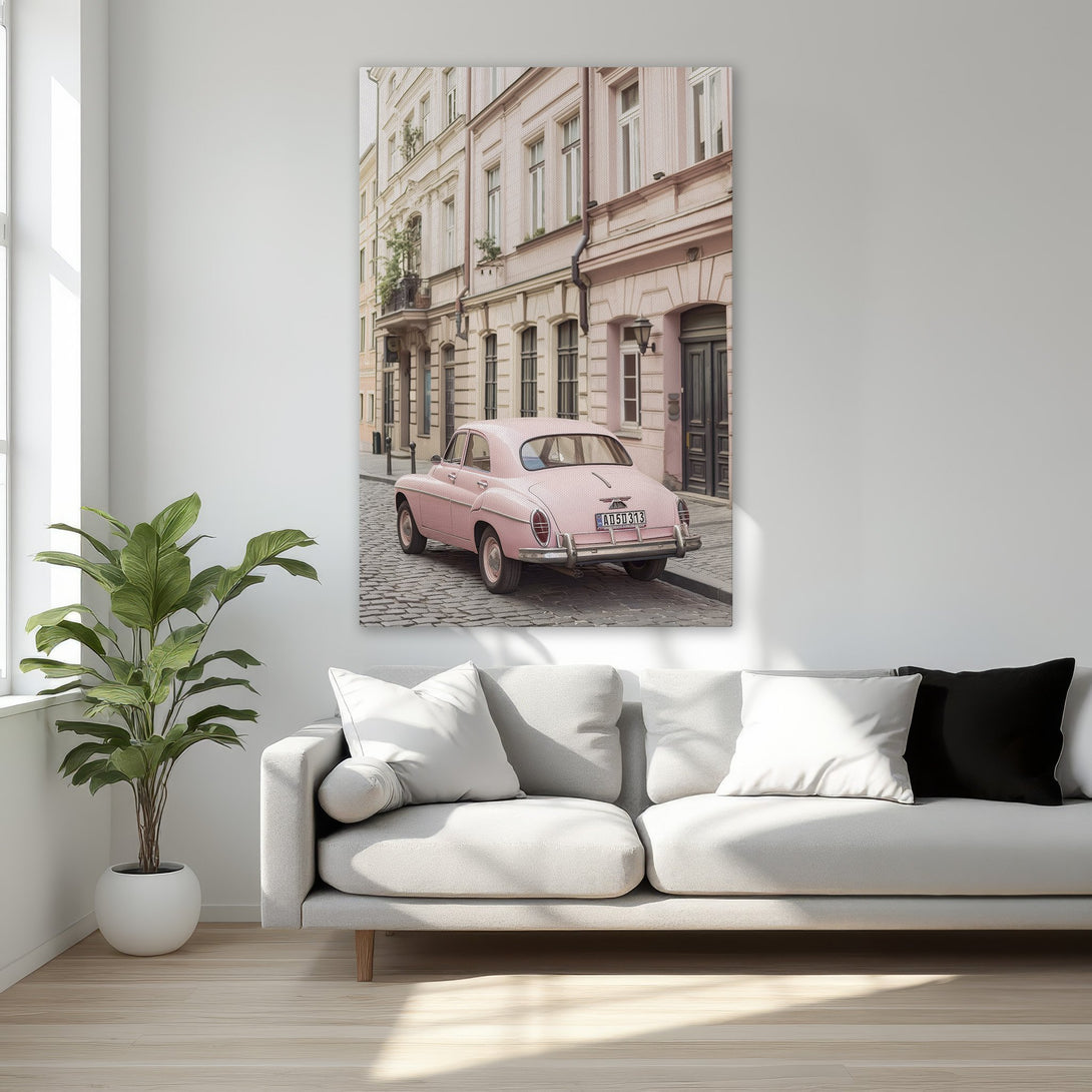 Framed Wall Art featuring a vintage pink car on a cobblestone street. Soft pink and beige color palette, perfect for adding a touch of vintage charm.