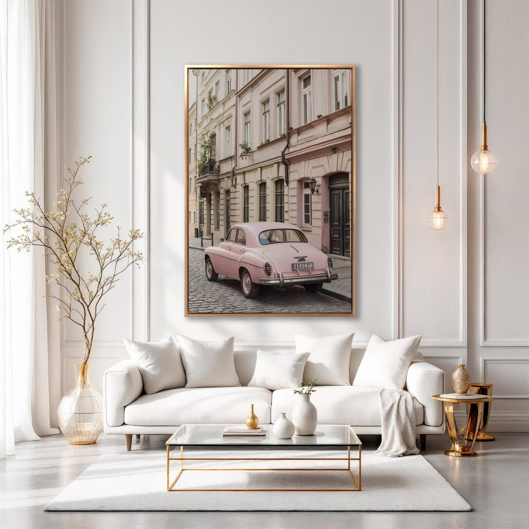 Framed Wall Art featuring a vintage pink car on a cobblestone street. Elegant, pastel-toned canvas print perfect for adding a touch of Parisian charm to your home decor.