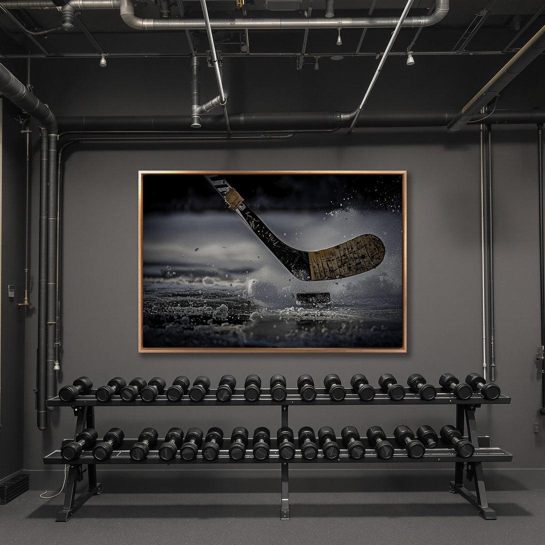 Framed Wall Art: Hockey action Canvas Print in a modern gym. Dramatic black and white image of a hockey stick and puck with a neutral color palette.