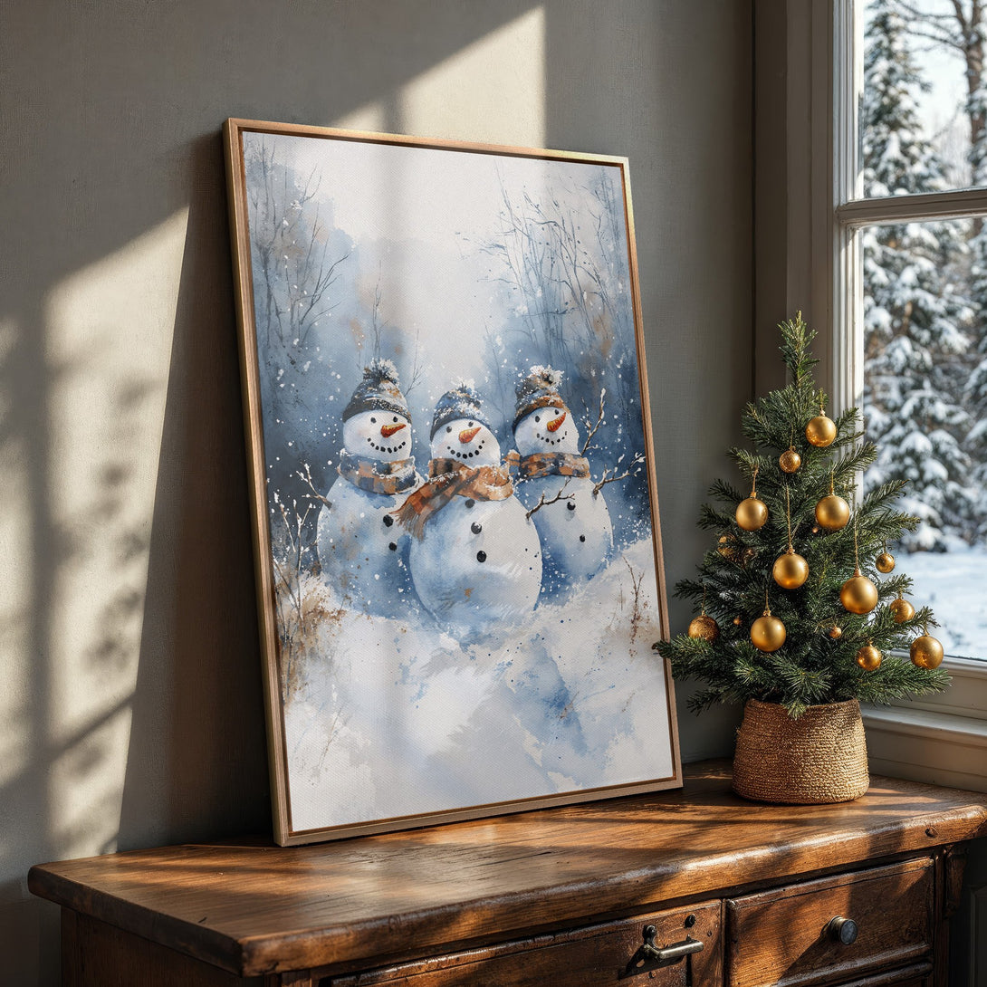 Framed Wall Art featuring watercolor snowmen in a winter scene. Blue and brown color palette, perfect for holiday decor.