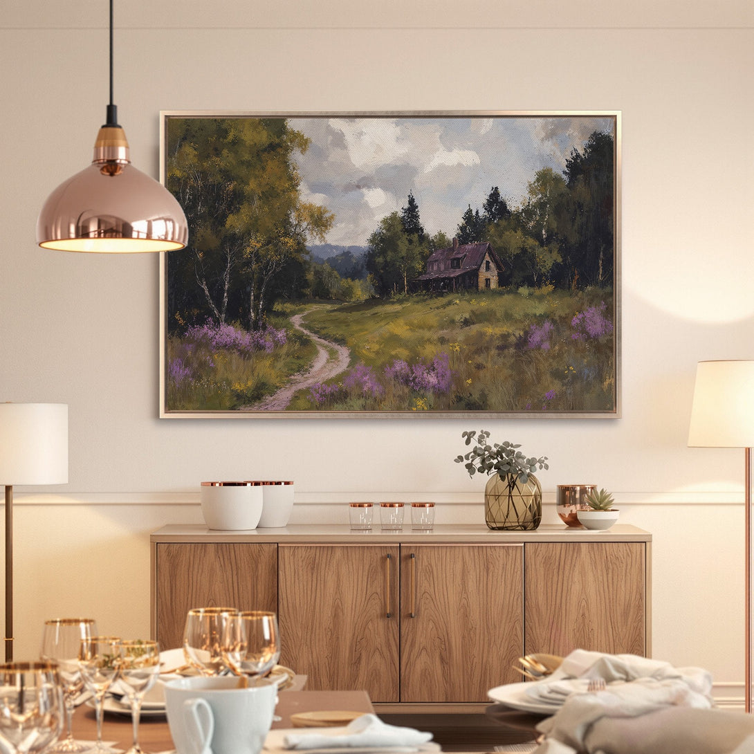 Framed Wall Art: Landscape painting of a cottage and path, featuring a green, purple, and brown color palette. Perfect for adding warmth to your home.