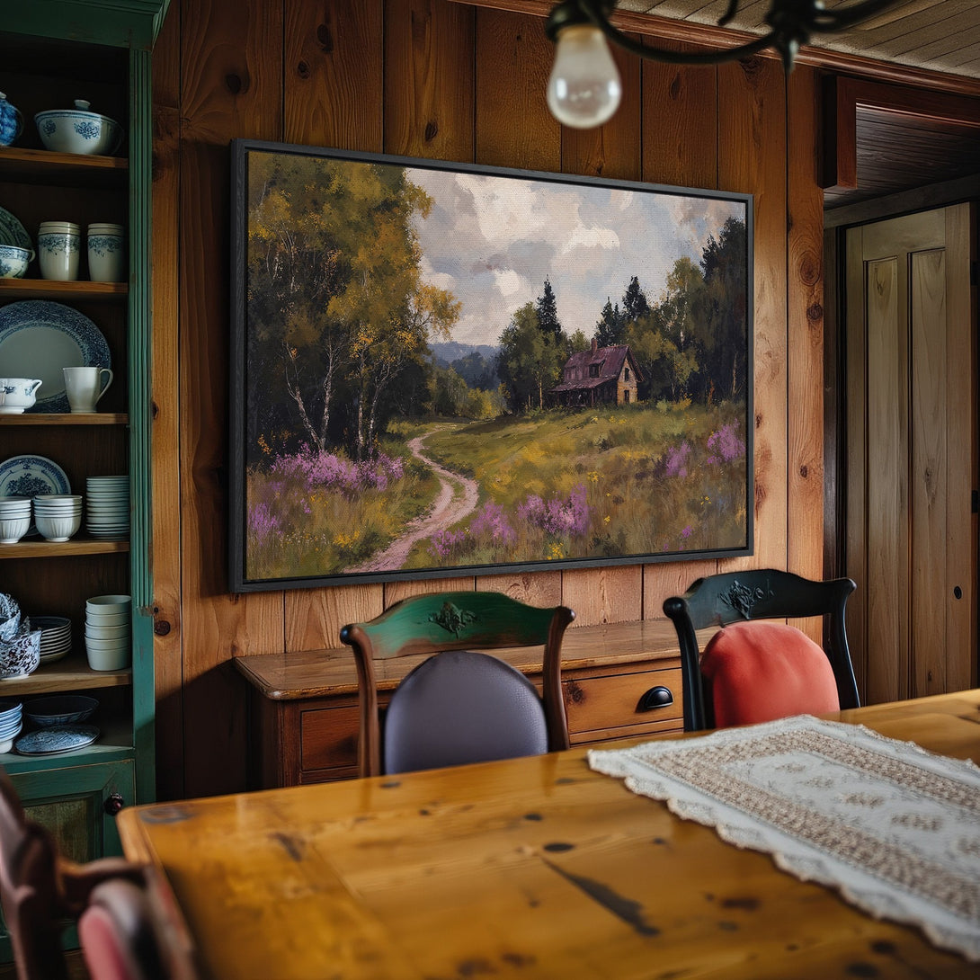Framed Wall Art: Landscape Canvas Print with a rustic cabin scene, featuring a warm color palette of greens, yellows, and purples. Perfect for cozy interiors.