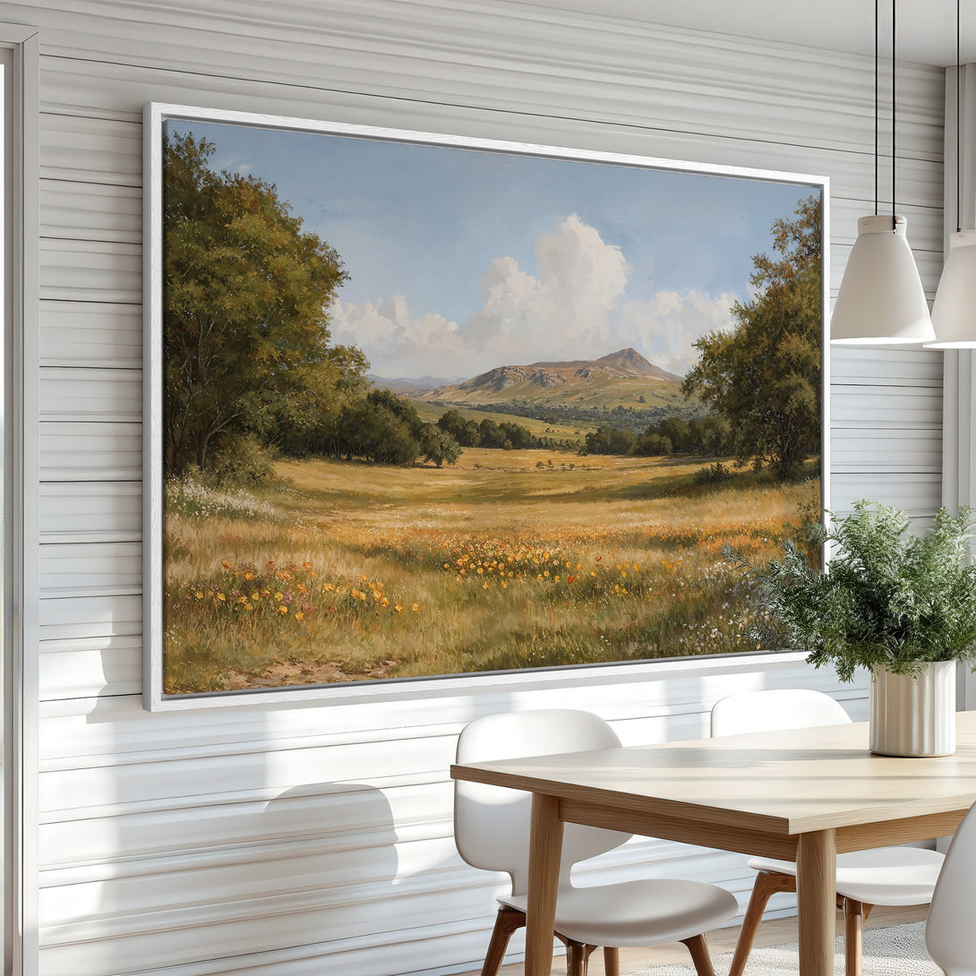 Framed Wall Art of a serene landscape painting with warm tones. Featuring a meadow, trees, and mountains. Perfect for adding a touch of nature to your home.