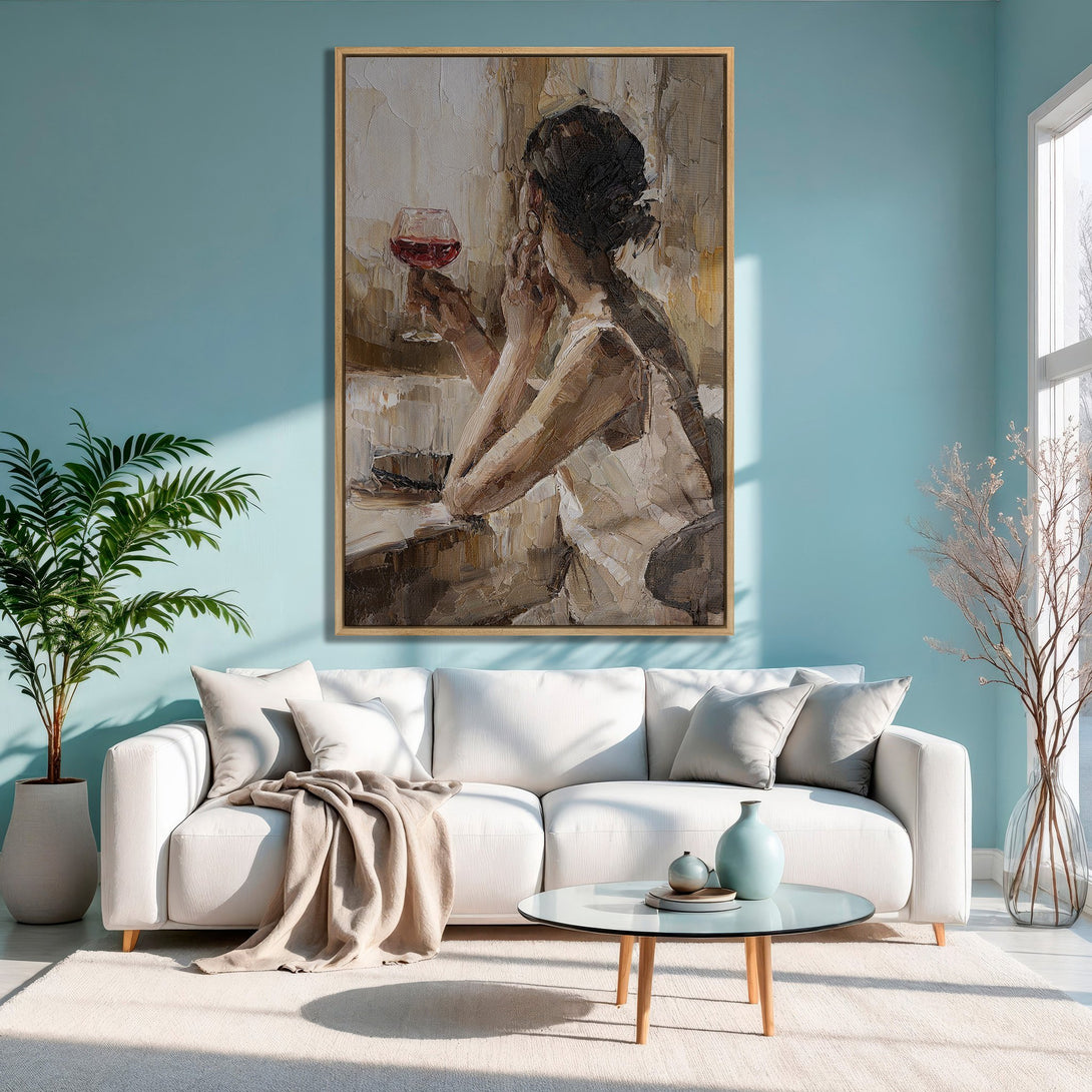 Framed Wall Art of woman with wine, impressionist style, warm neutrals & red accents, displayed in a modern living room with blue walls.