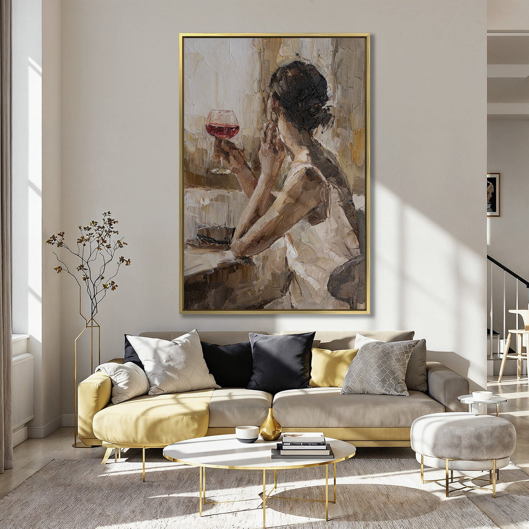 Canvas Print of woman with wine, impressionistic style, warm neutral tones with pops of red, displayed in a cozy interior.
