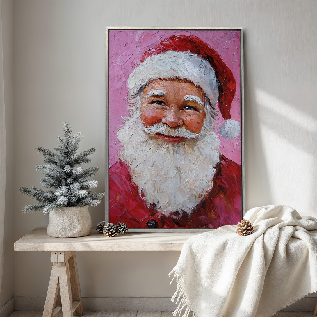 Framed Wall Art of Santa Claus in a painterly style, featuring a red and pink color palette. Perfect Christmas decor for your home!